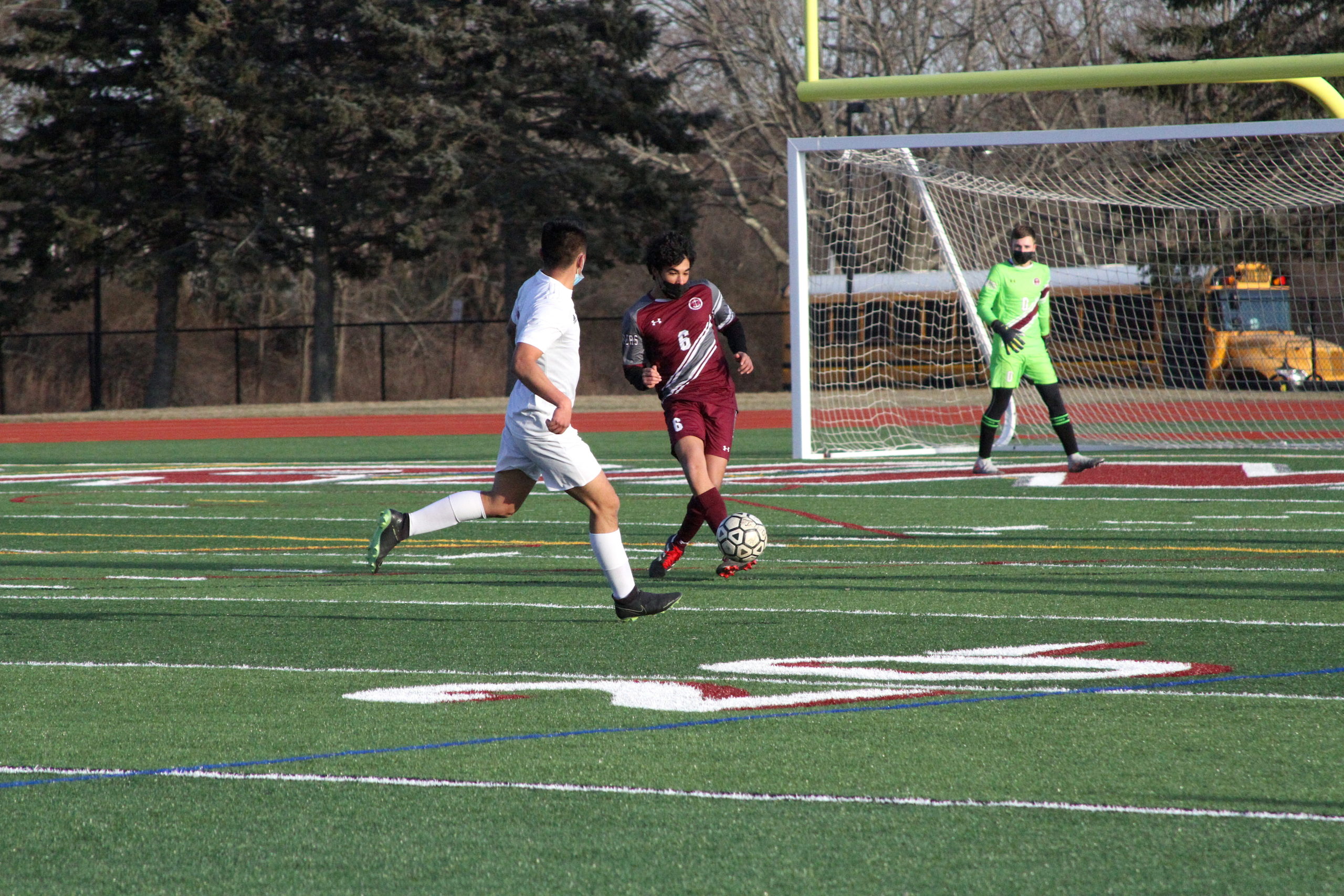 Southampton junior defender Brandon Mendez moves the ball around Hampton Bays senior midfielder and forward Danny Alvarracin.