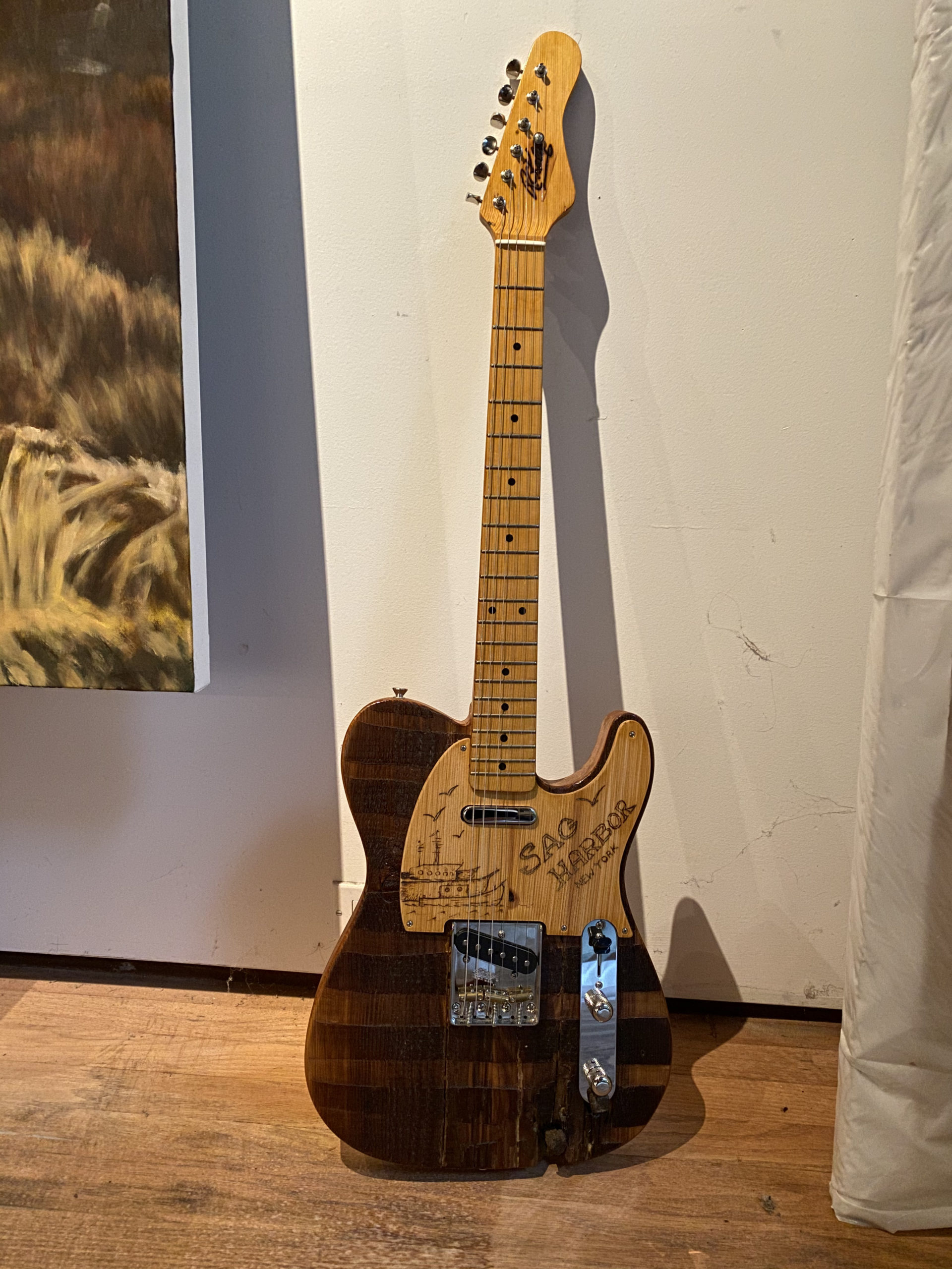 A guitar made of wood from The Church by Carmine Street Guitars.