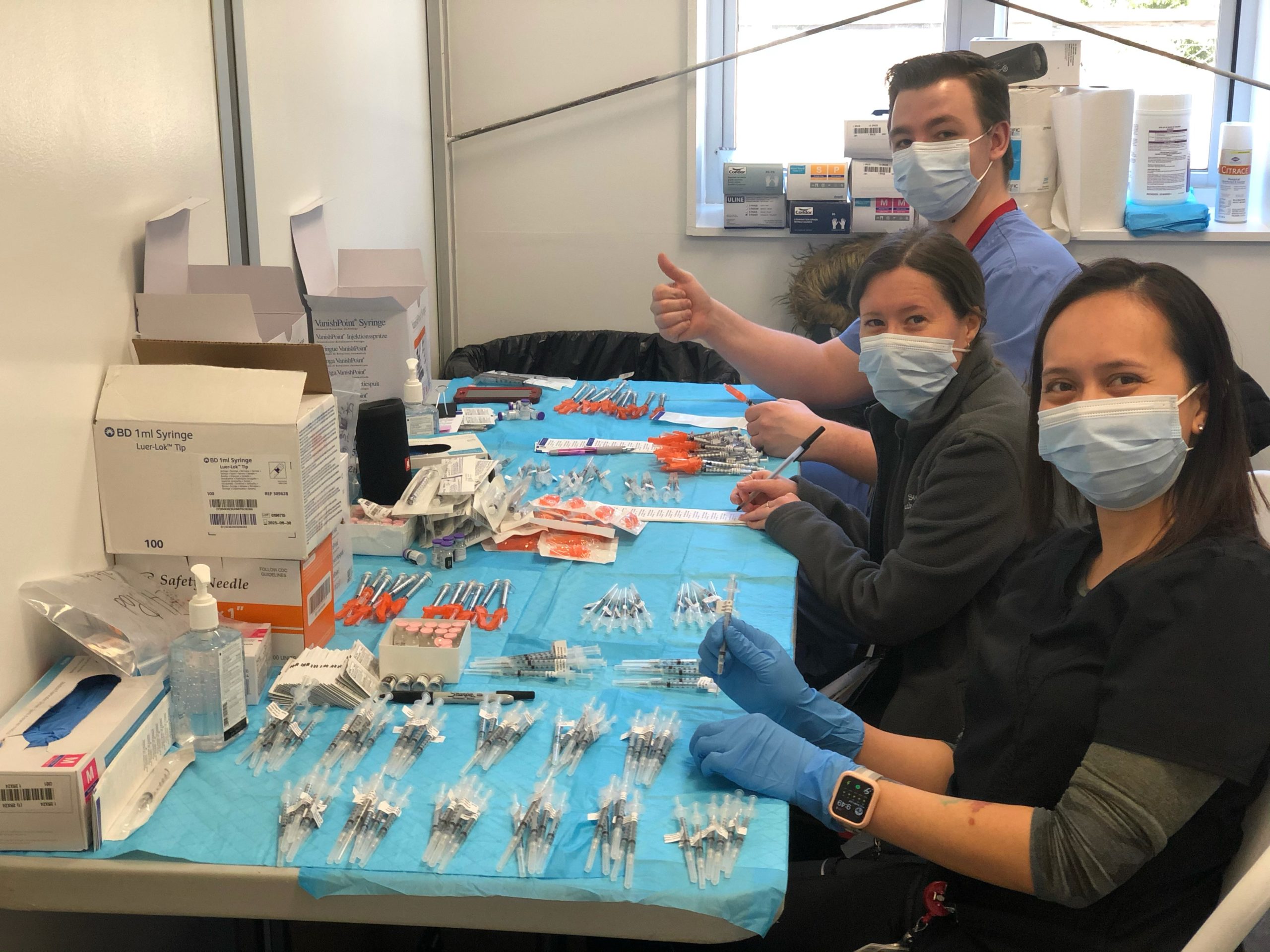 Stony Brook Southampton Hospital staff preparing vaccination shots at the East Hampton POD on Friday.