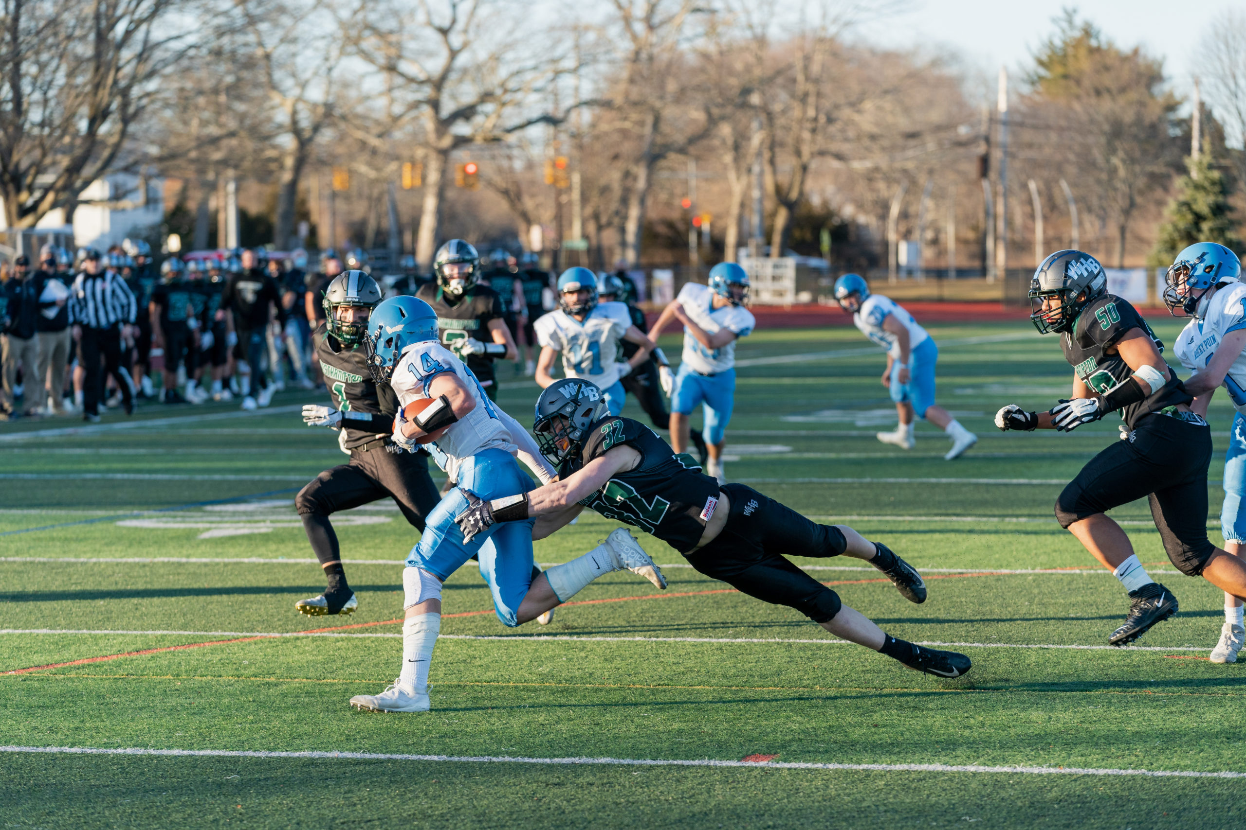 Westhampton Beach senior Gavin McIntyre makes an open-field tackle on a Rocky Point kick returner.