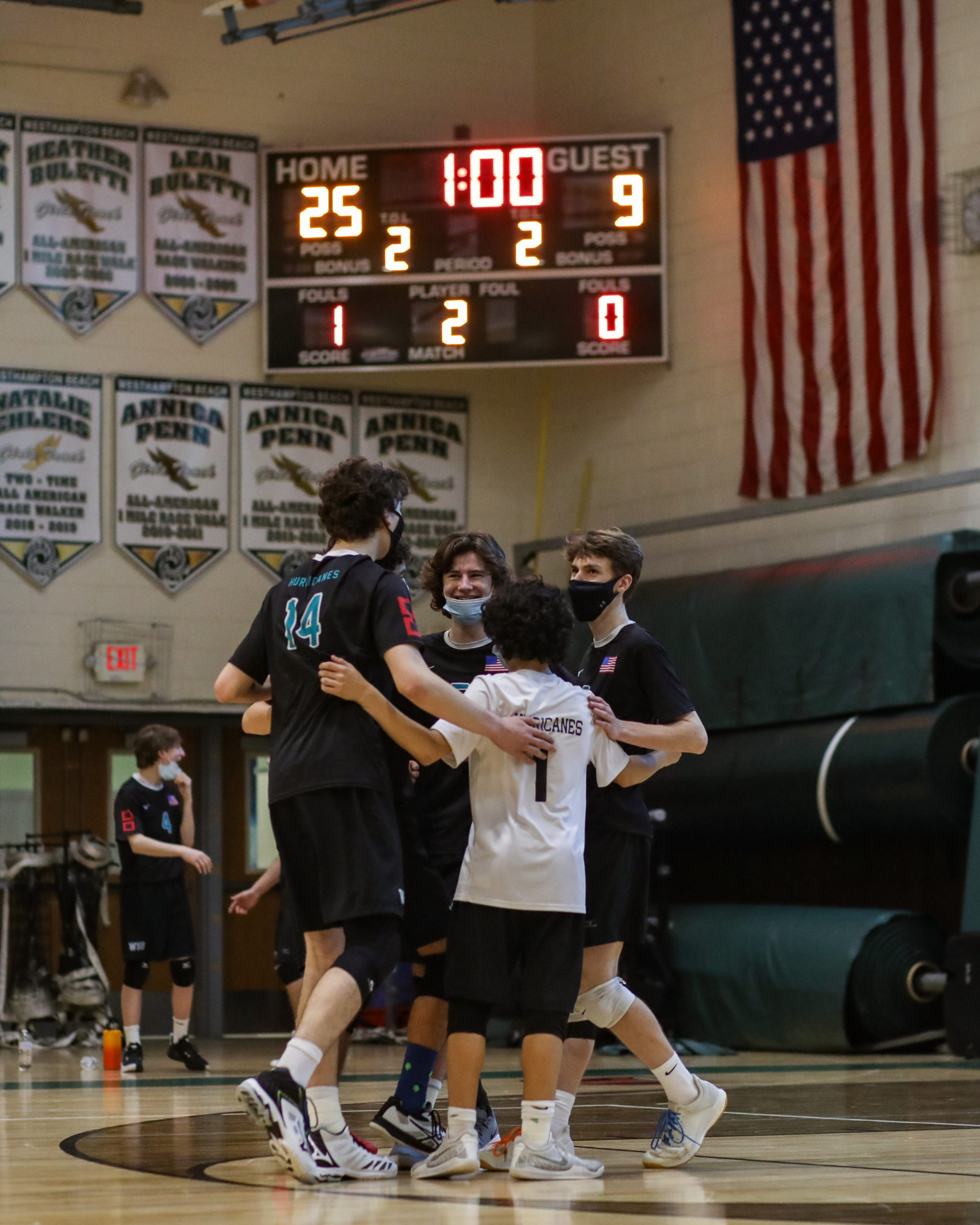 Westhampton Beach's boys volleyball team celebrates an early second-set win.