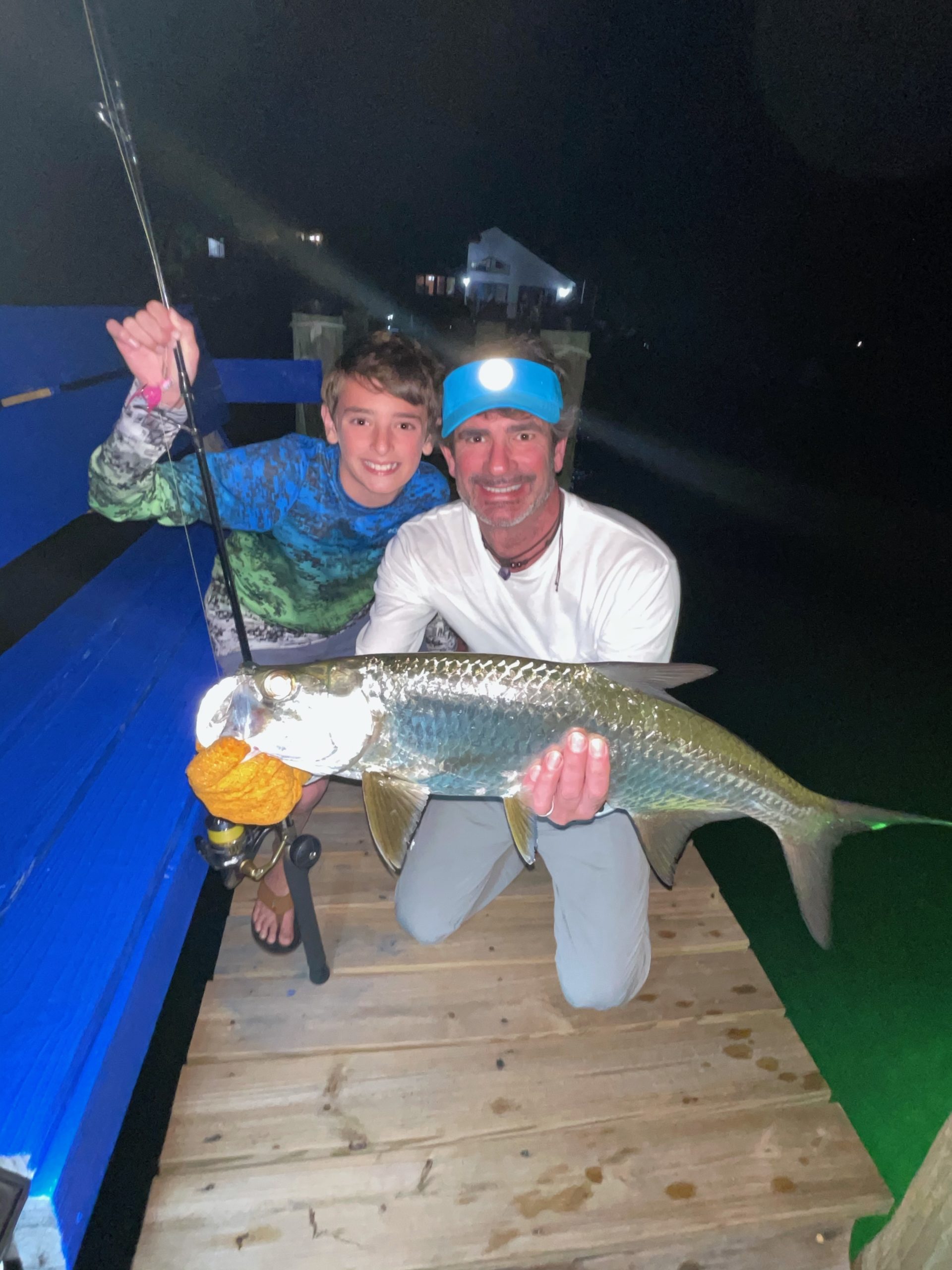 Joe and Taylor Baratta with a Florida Keys tarpon they caught from shore while on vacation last month.