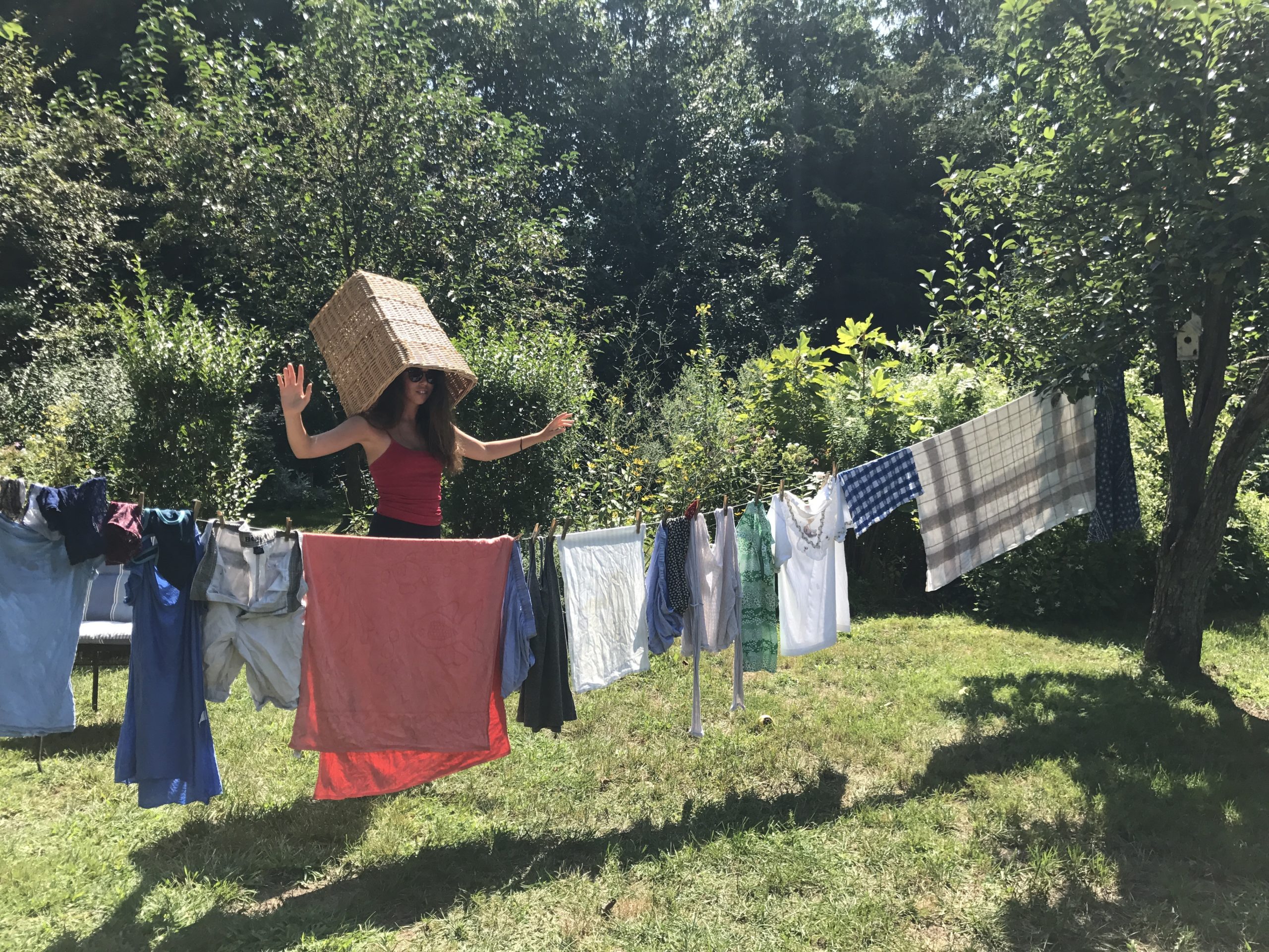 Teenager Carley Wootton demonstrates that air drying laundry tree-to-tree isn’t always done efficiently.