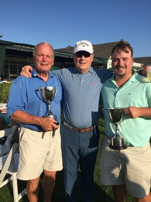 Chris, left, and C.J. Andrews, right, with golf pro Bobby Jenkins, after winning the Father-Son Golf Tournament July 2017 at the Westhampton Country Club.