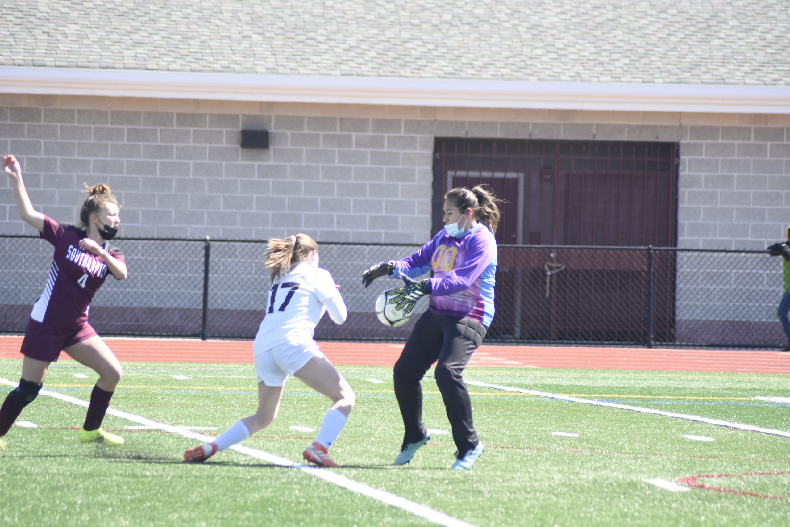 Southampton senior goalie Kendra Jimenez comes out to play a loose ball in the box before a Babylon player gets to it.