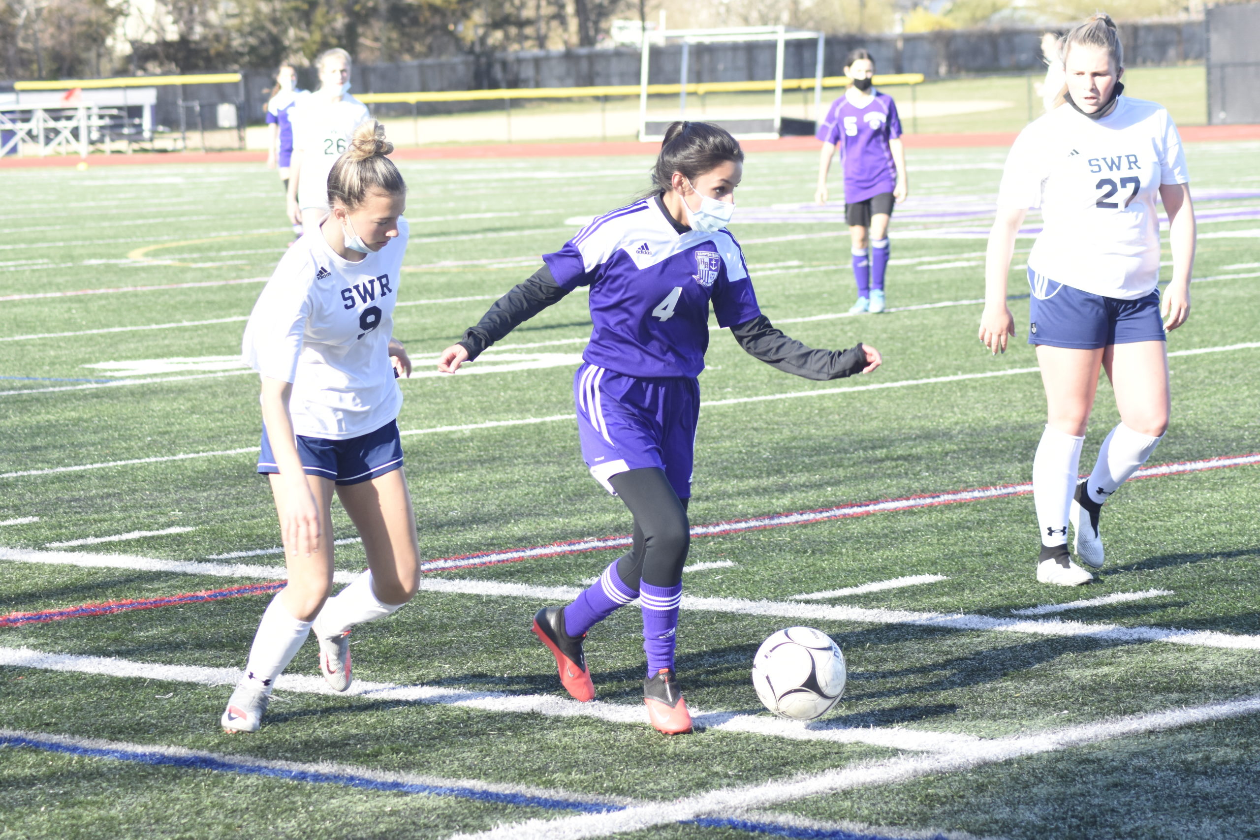 Hampton Bays sophomore Samantha Garcia plays the ball back to a teammate.