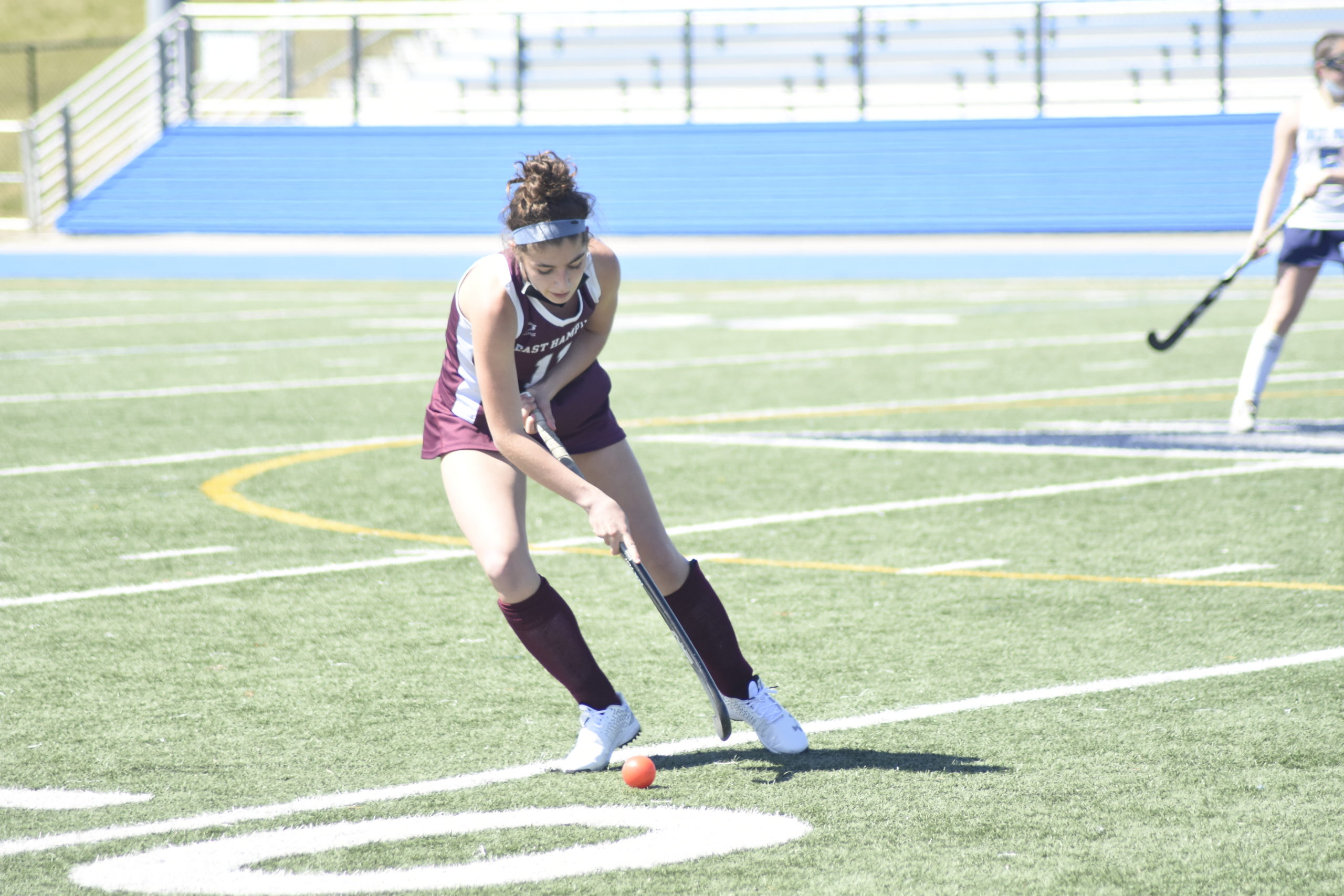 East Hampton junior Ella Bistrian finds the ball in the open field.
