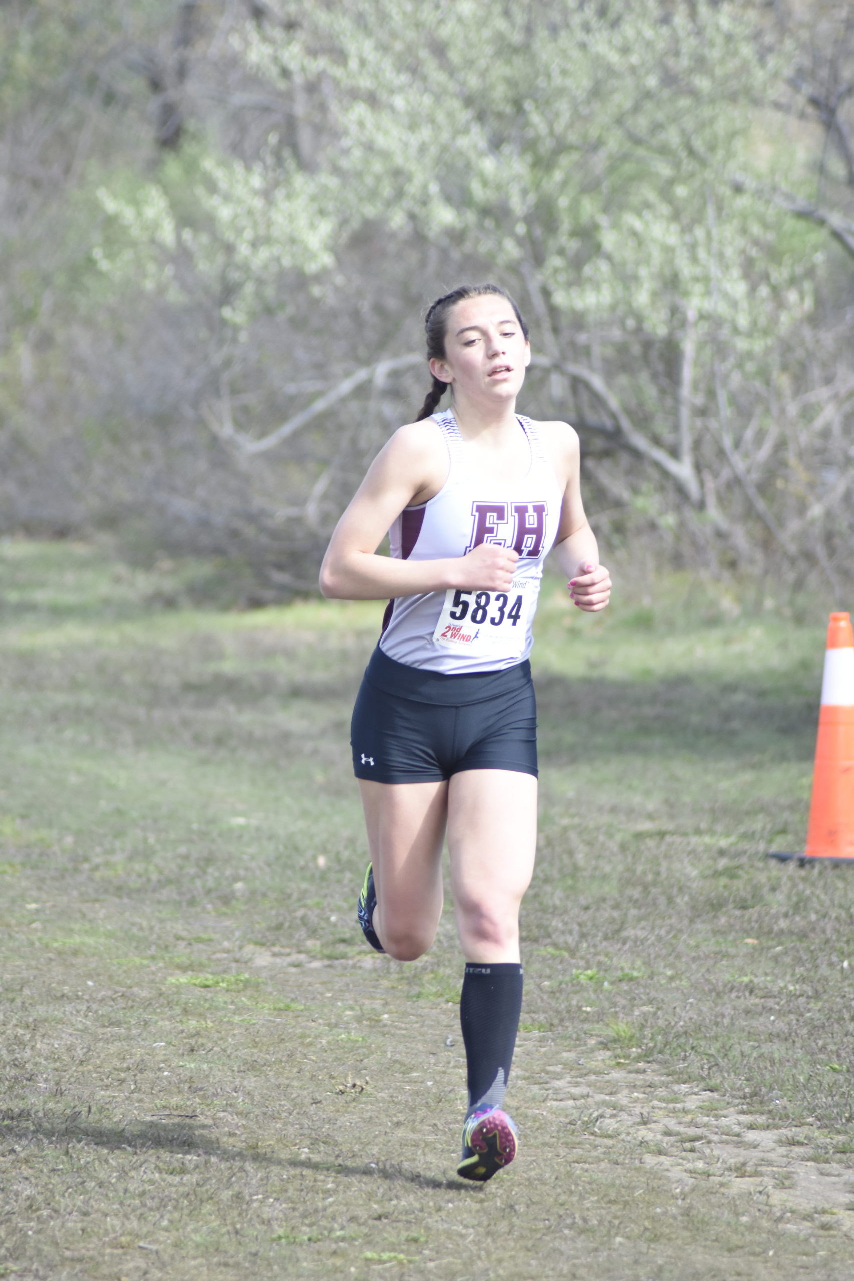 East Hampton senior Bella Tarbet finishes the Suffolk County Class B race on Thursday, April 21.