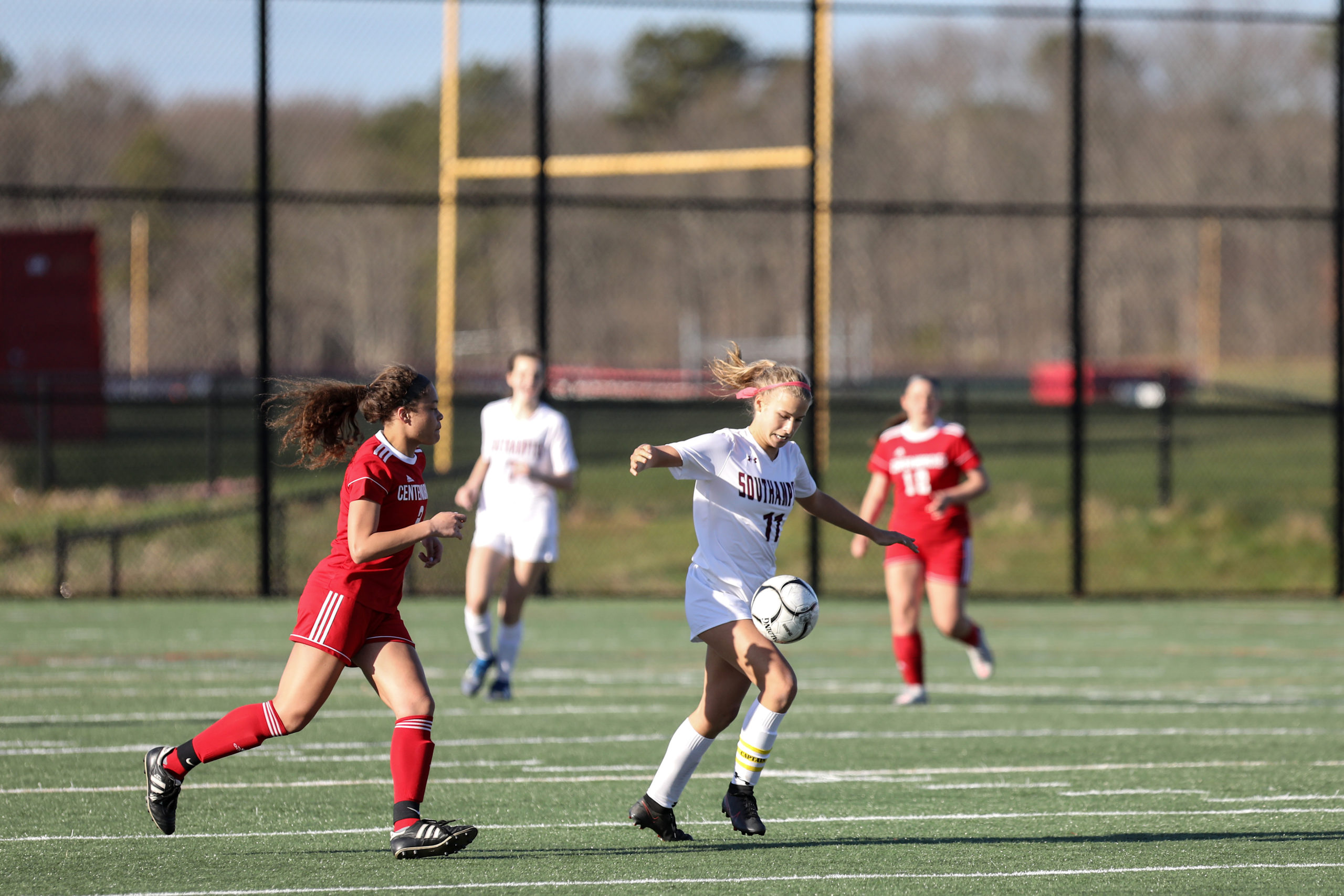 Southampton junior Charlotte Cardel carries the ball across the field.