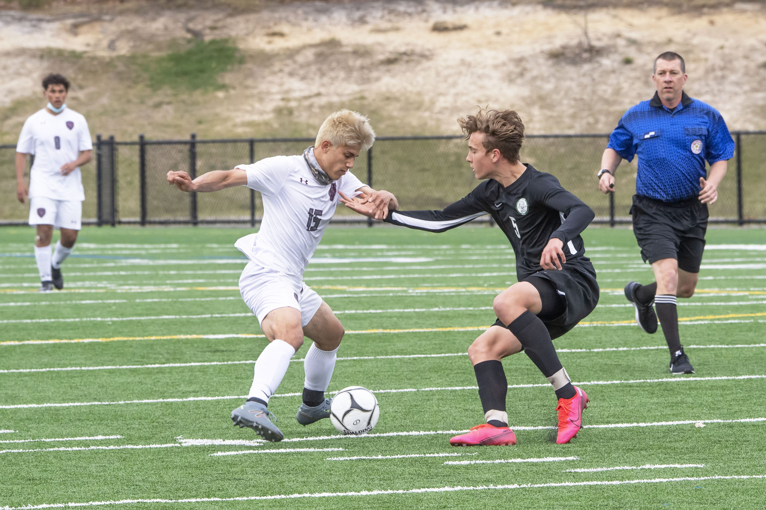 East Hampton's Alex Vanegas scraps for control of the ball.