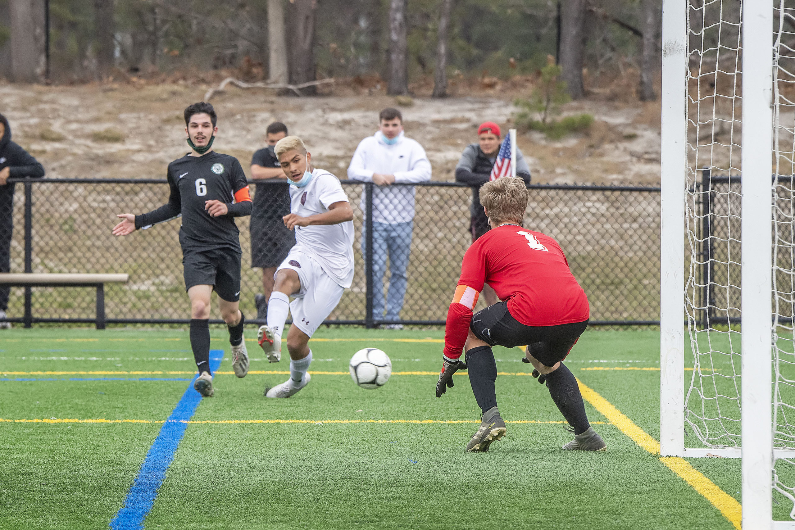 East Hampton's Nicolas Cifuentes-Diaz takes a shot on goal.