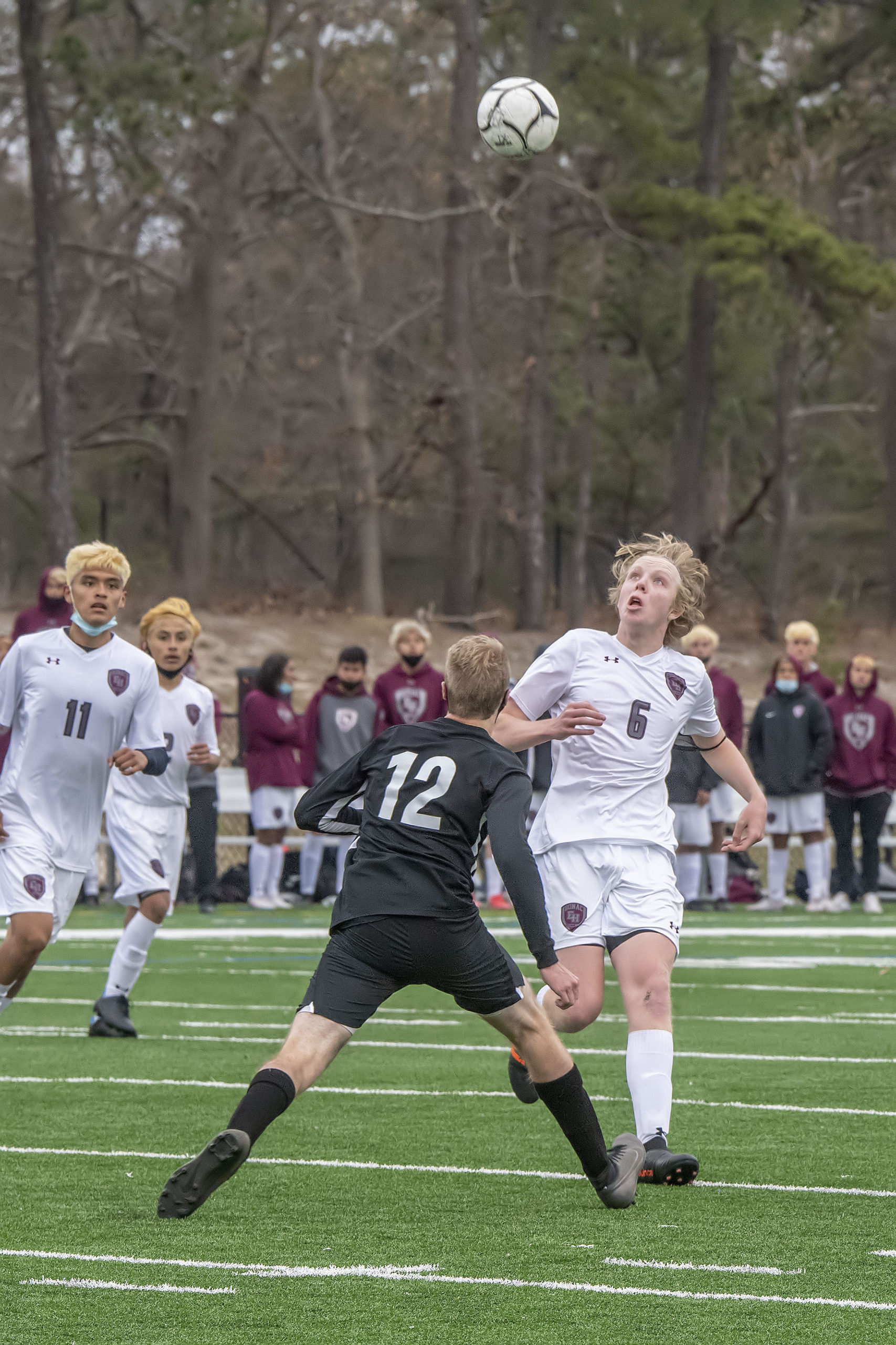 East Hampton's Matt McGovern eyes a return on a bouncing ball.