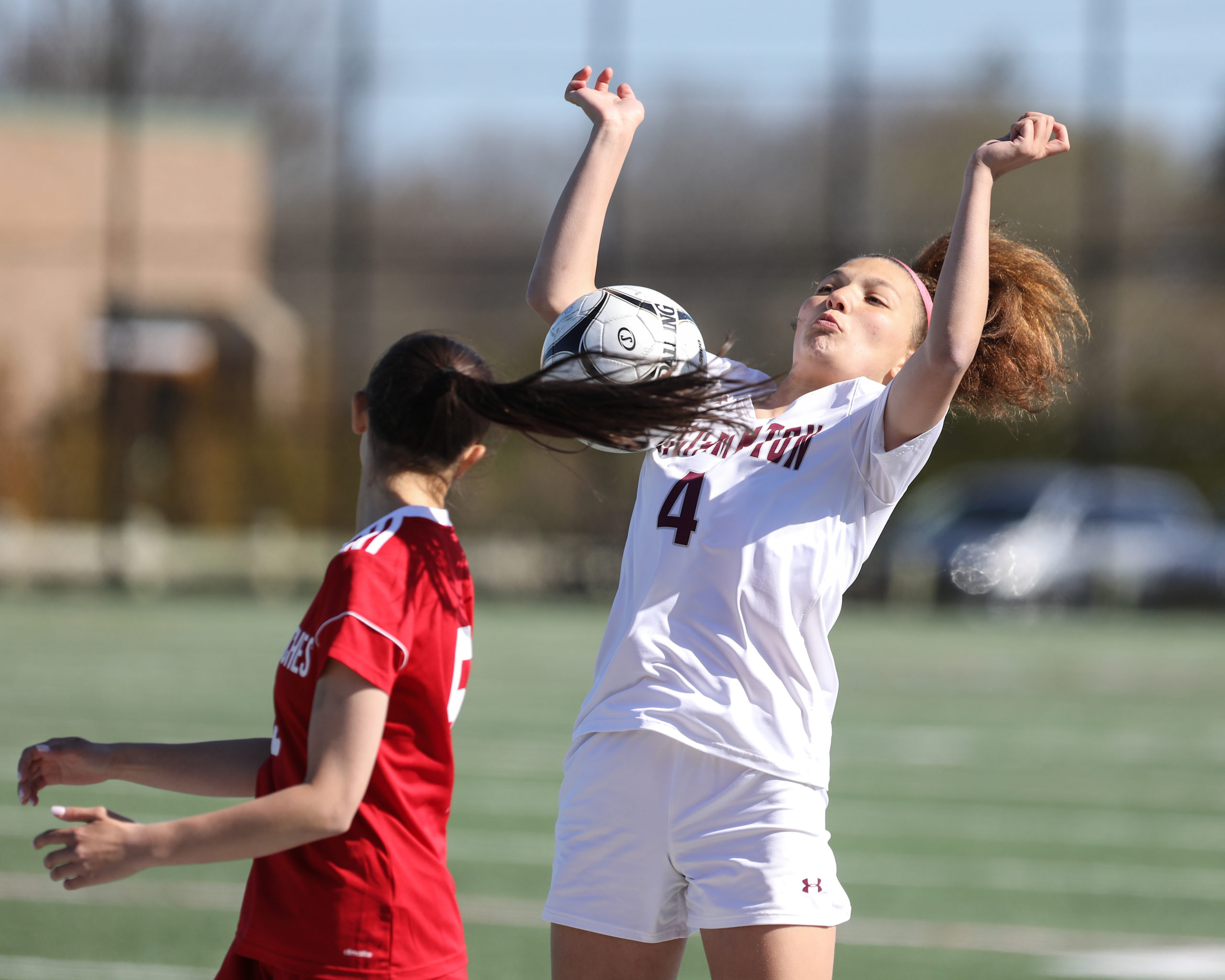 Southampton junior Gabriella Arnold uses her body to keep the ball in play.