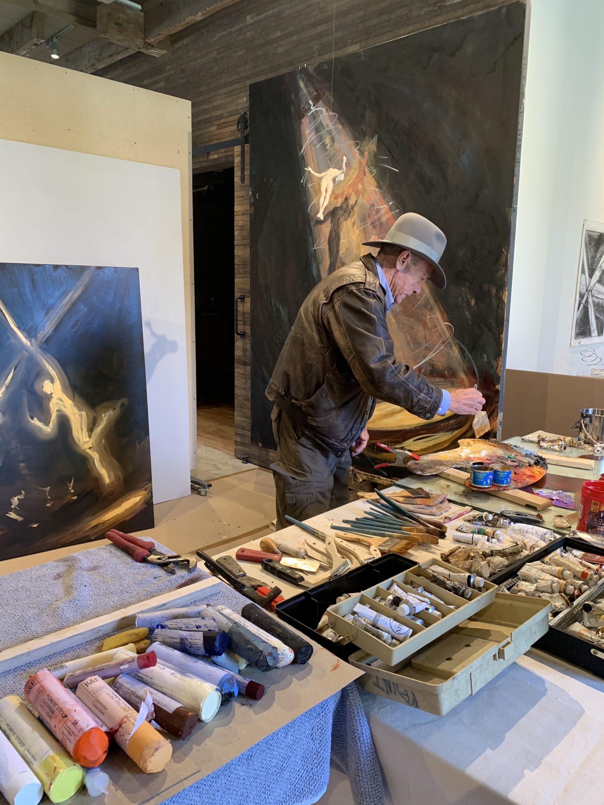 Jim Ginerich at work on a painting.