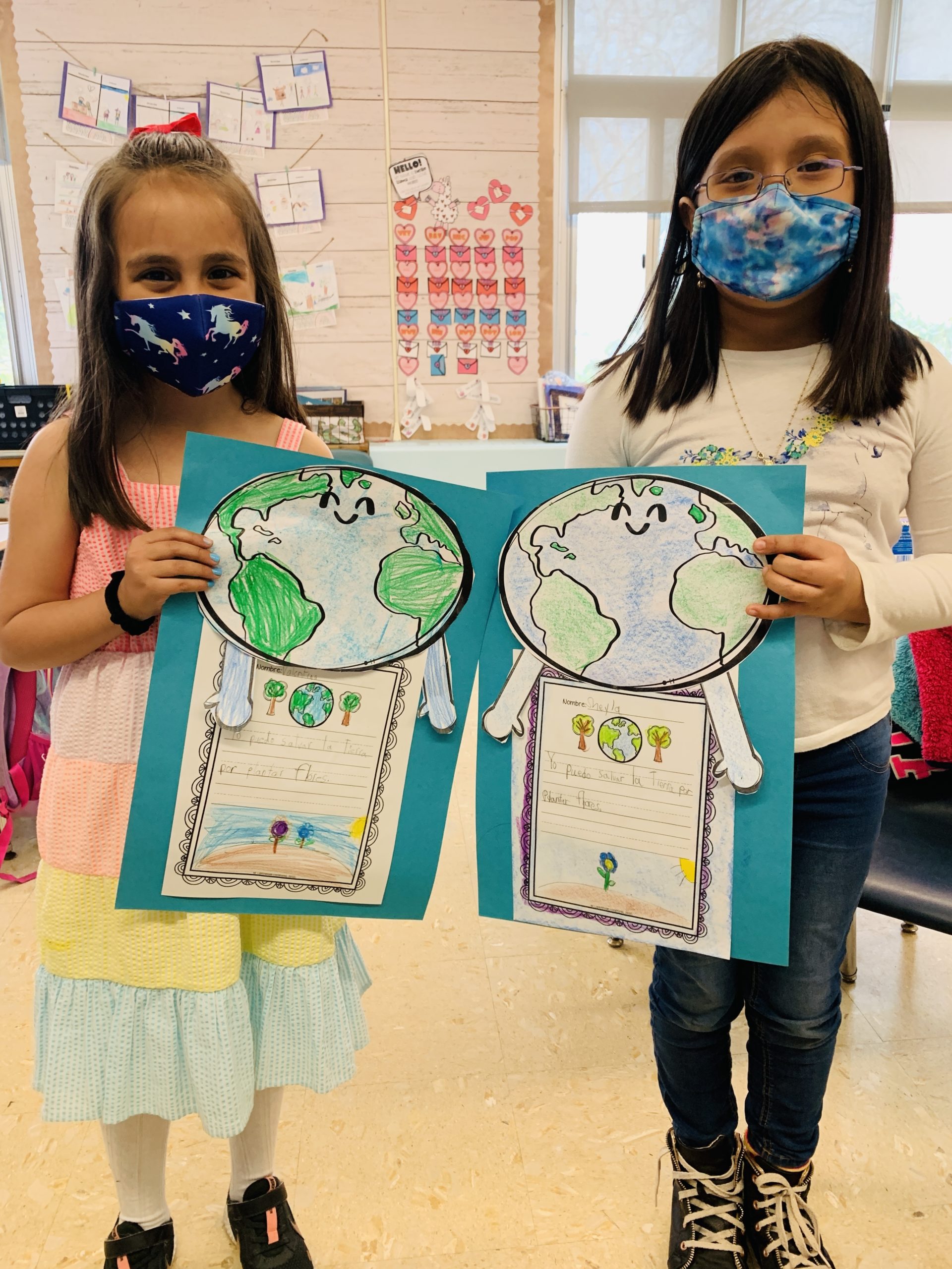 Hampton Bays Elementary School students show off their Earth Day art.