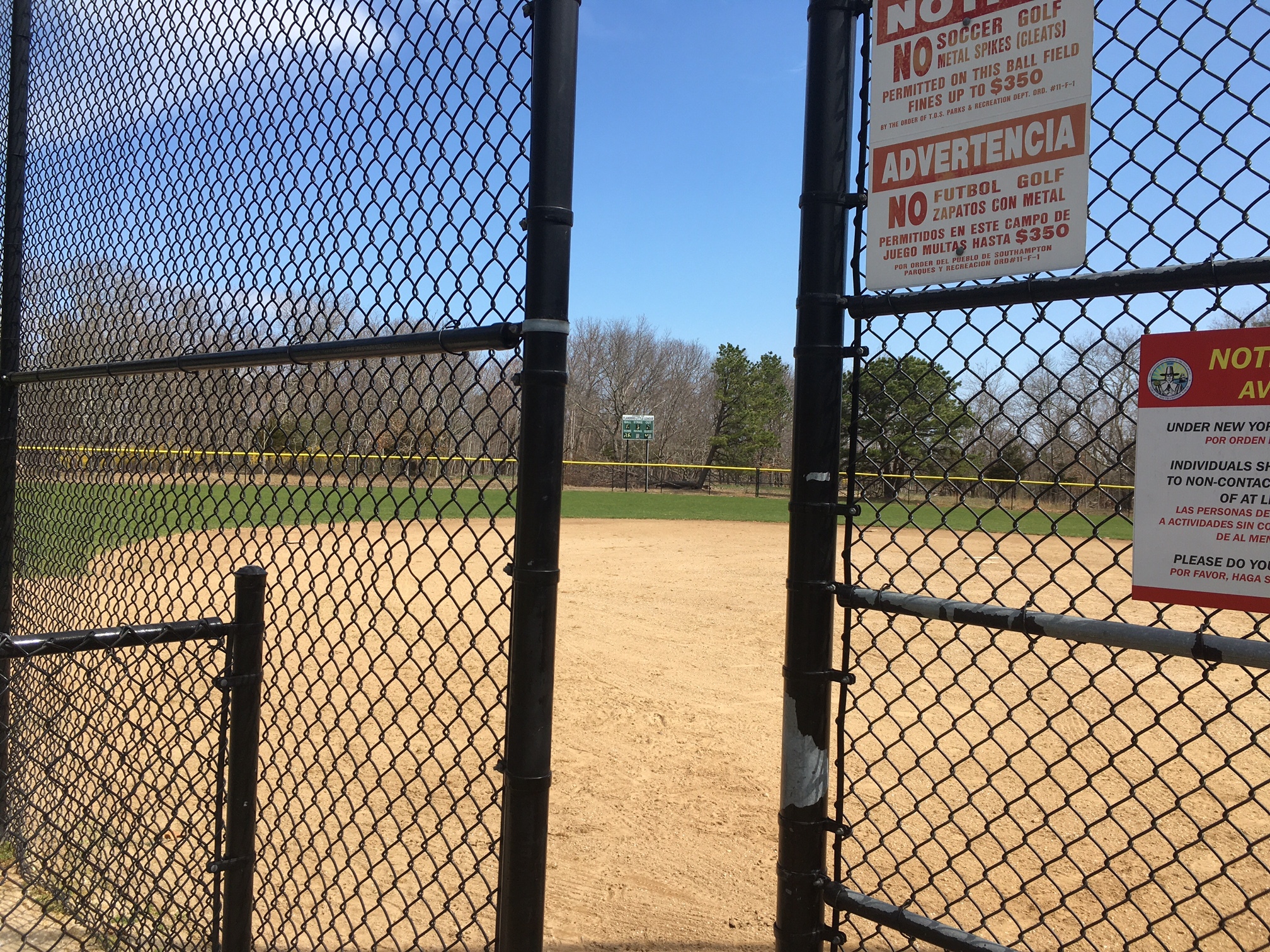 On a sunny spring Saturday, the ballfield at Iron Point Park is empty.