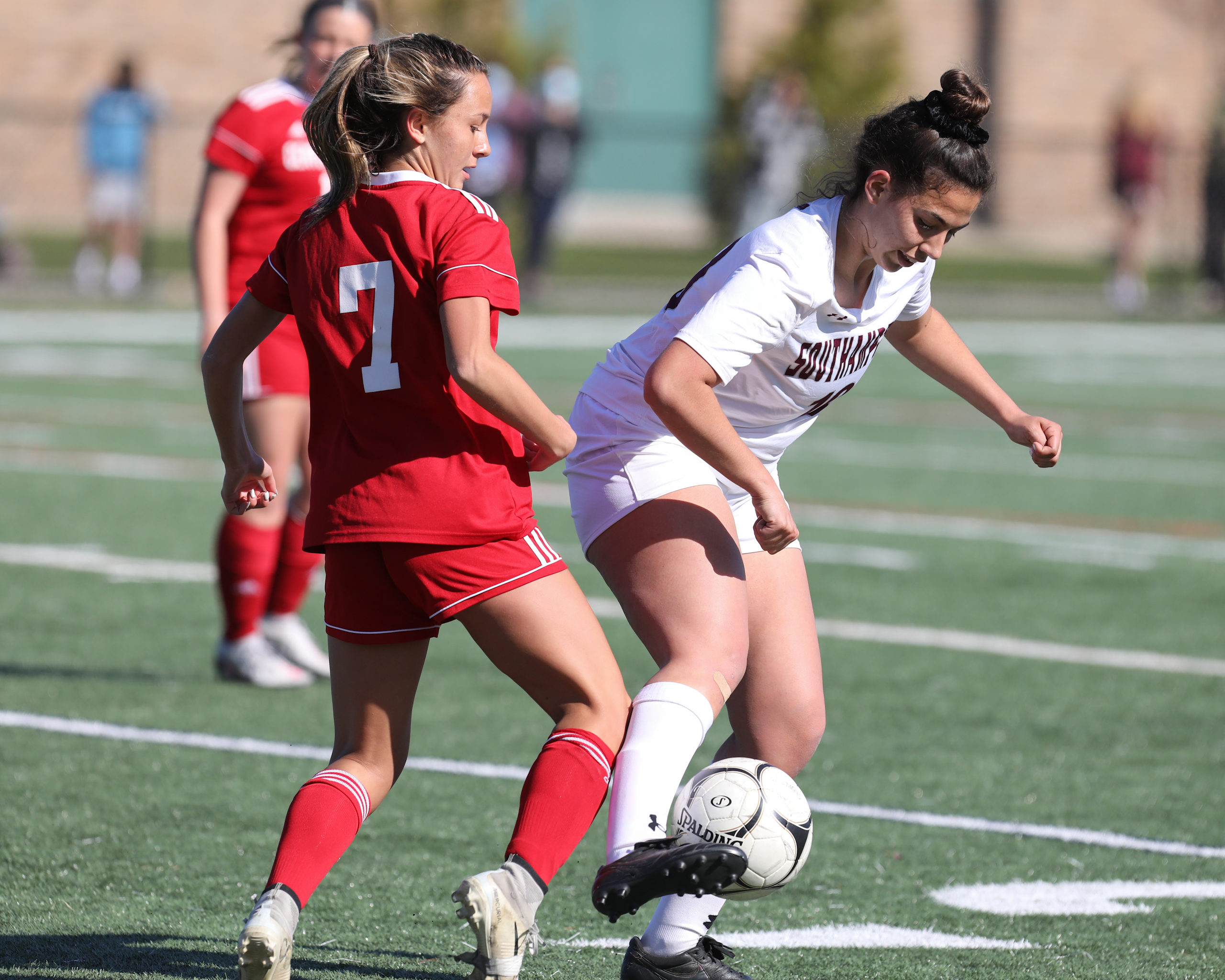 Southampton junior Isabelle Palumbo keeps Center Moriches away from the ball.