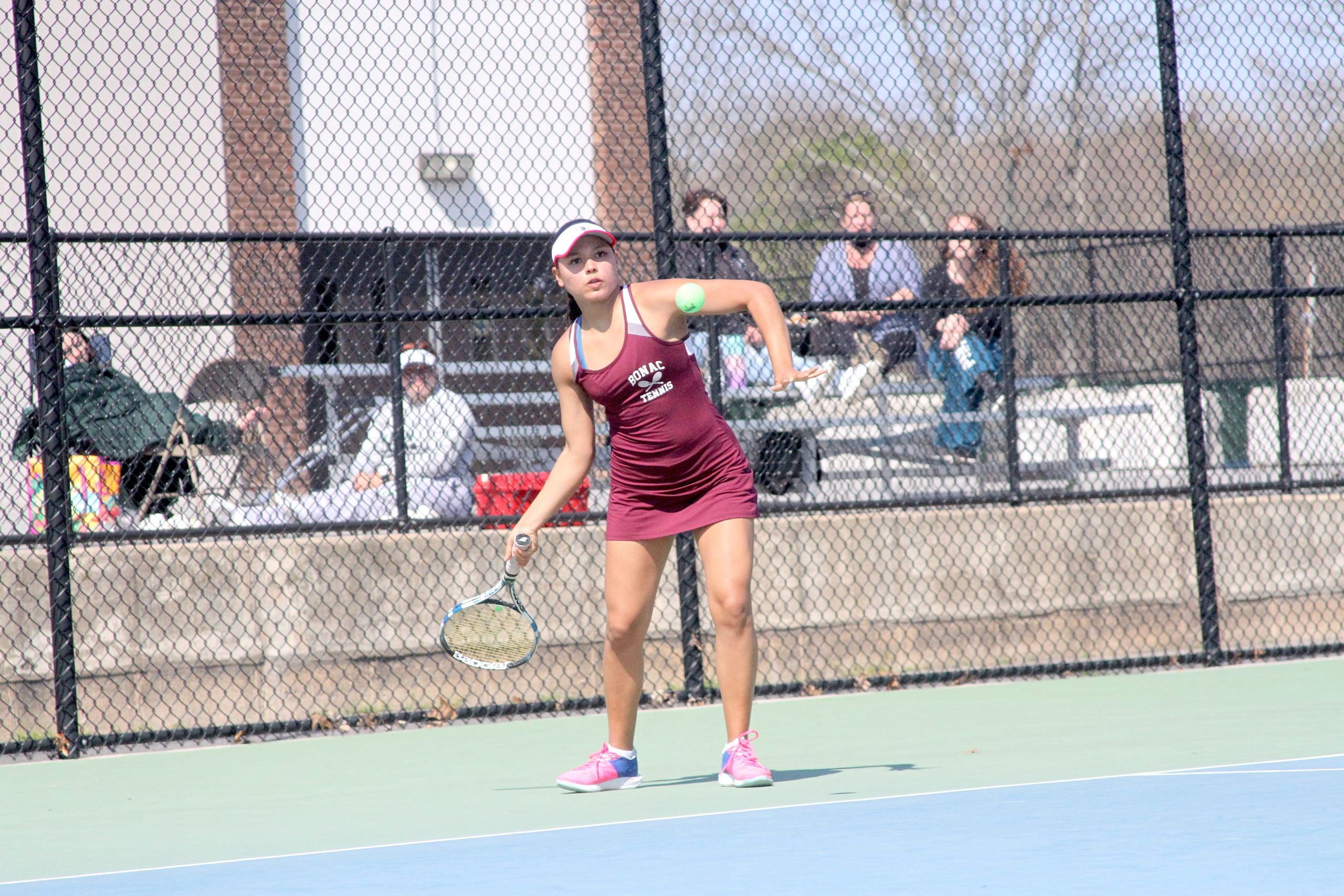 Pierson senior Juliana Barahona returns the ball for East Hampton in the Division IV doubles finals.