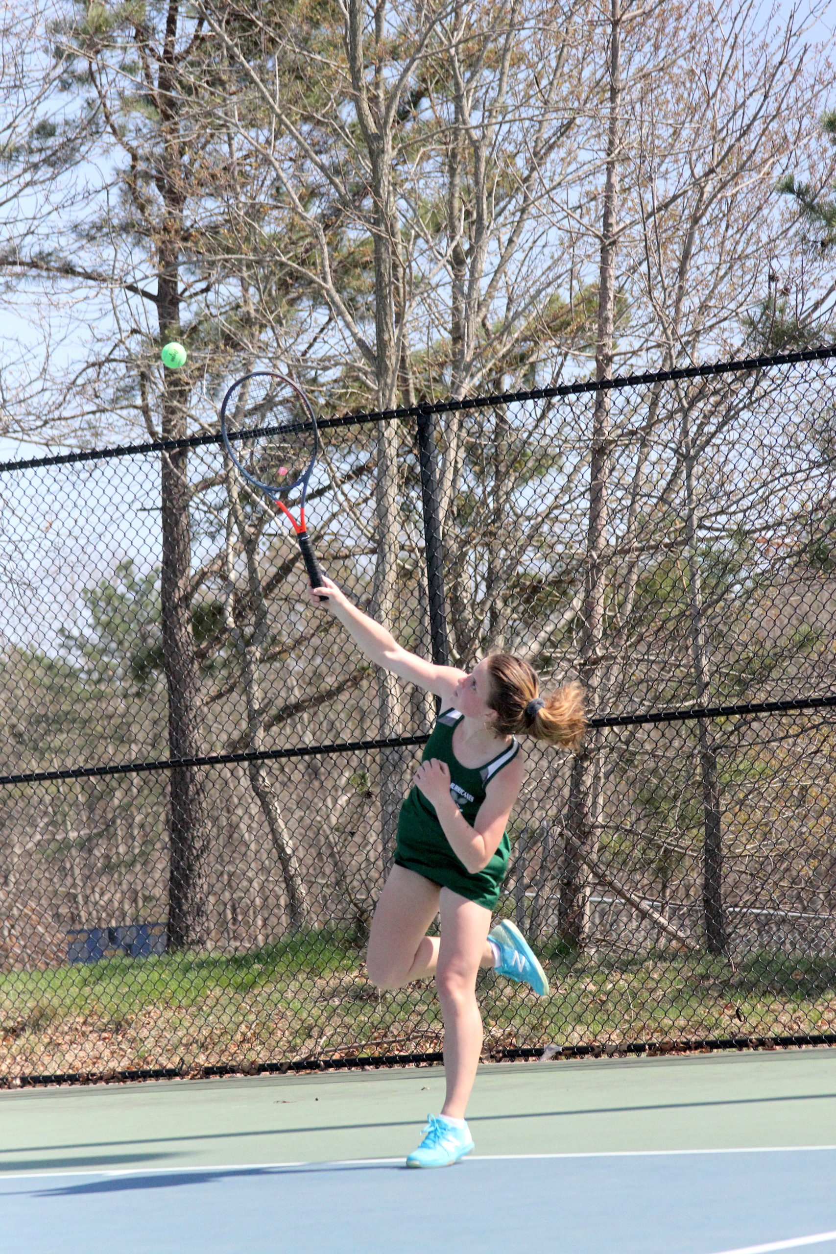 Westhampton Beach junior Katelyn Stabile serves up an ace in the Division IV doubles finals on Tuesday.