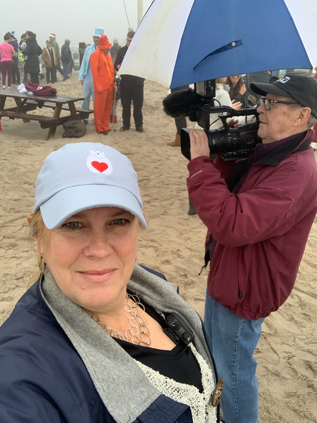 Katherine Styler Feldman and her father, Charles Styler, on the job for SEA-TV at the 2019 Polar Bear Plunge.