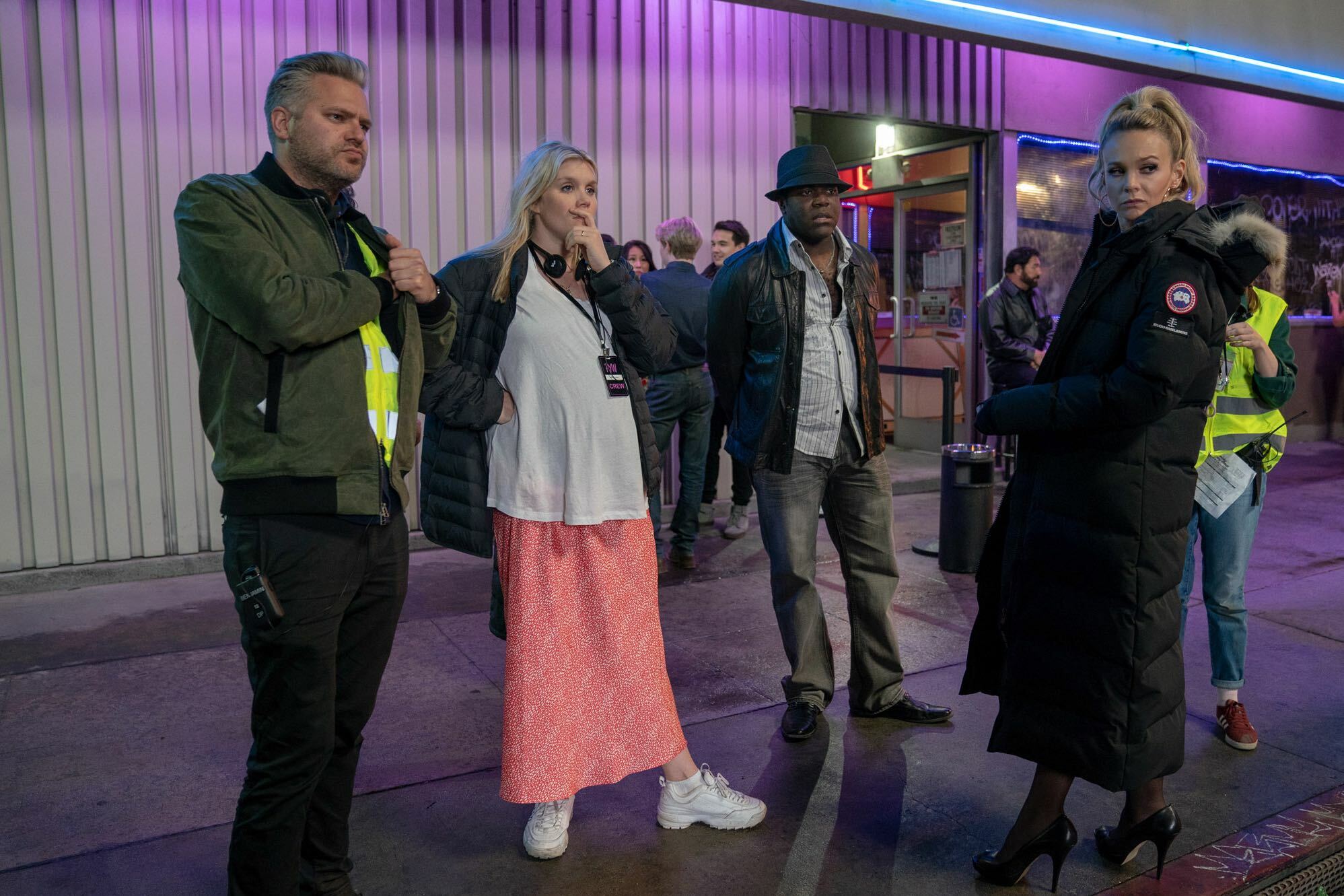 From left, director of photography Benjamin Kracun, writer/director Emerald Fennell, actor Sam Richardson, and actor Carey Mulligan on the set of 