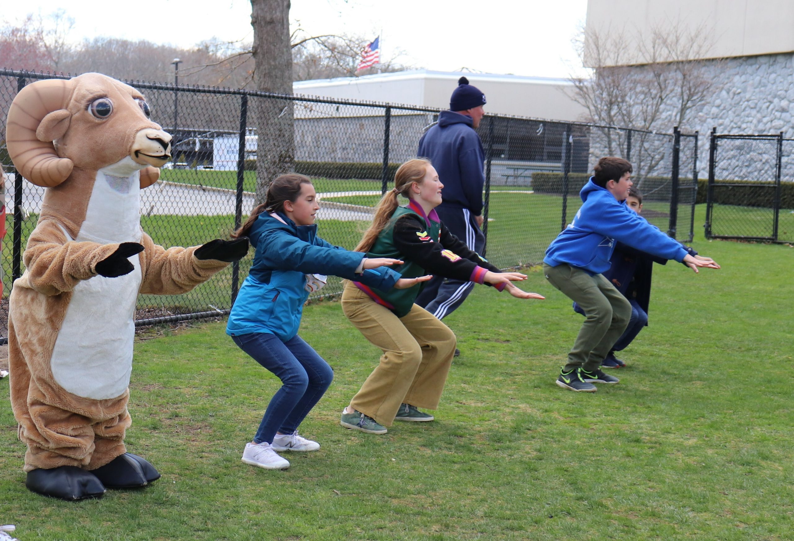 Raynor Country Day School students and staff, as well as the school mascot, Rocky join in the schoolwide Earth Day celebration: Healthy You—Healthy Me!