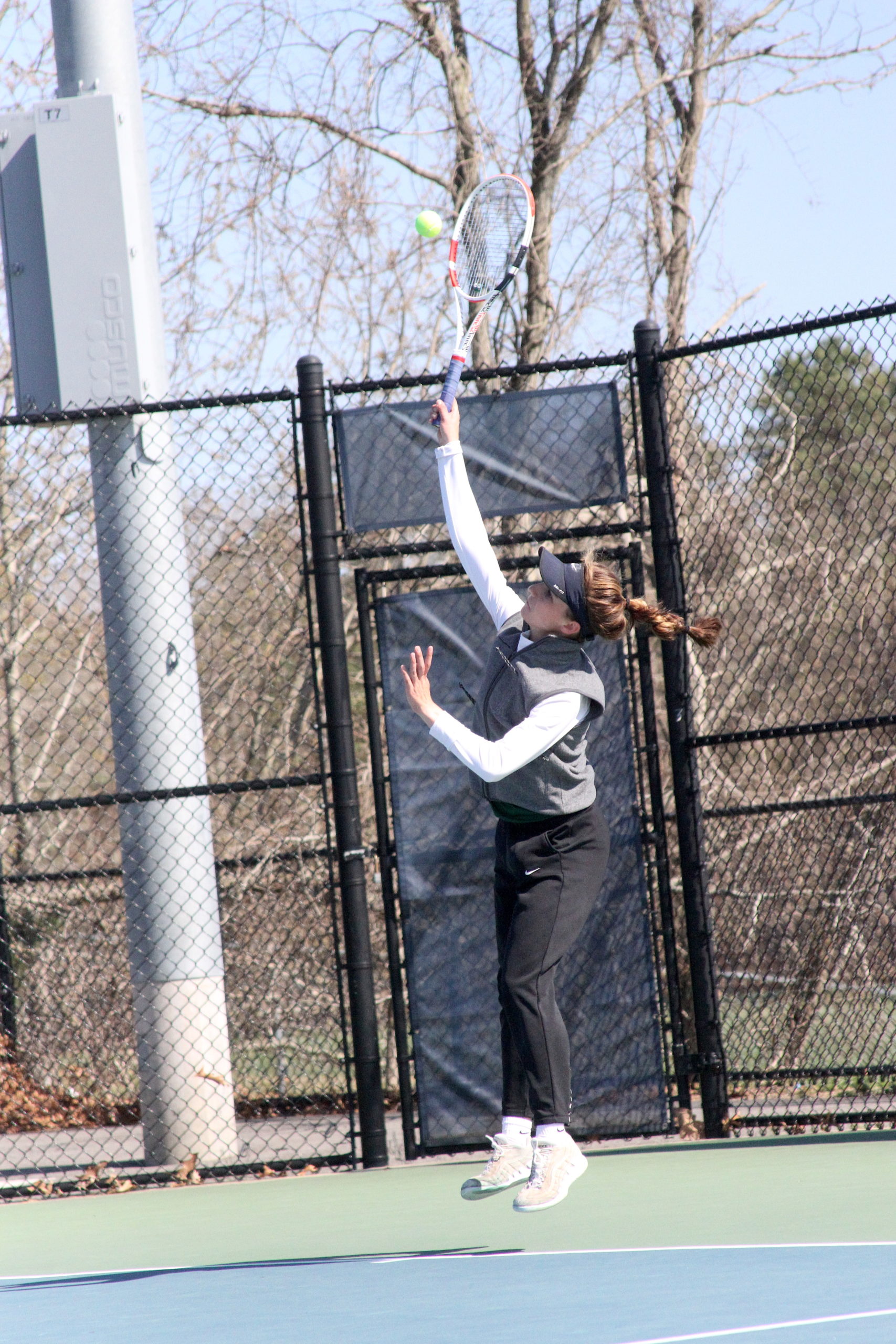 Westhampton Beach junior Rose Hayes serves the ball during her Suffolk County singles quarterfinal match.