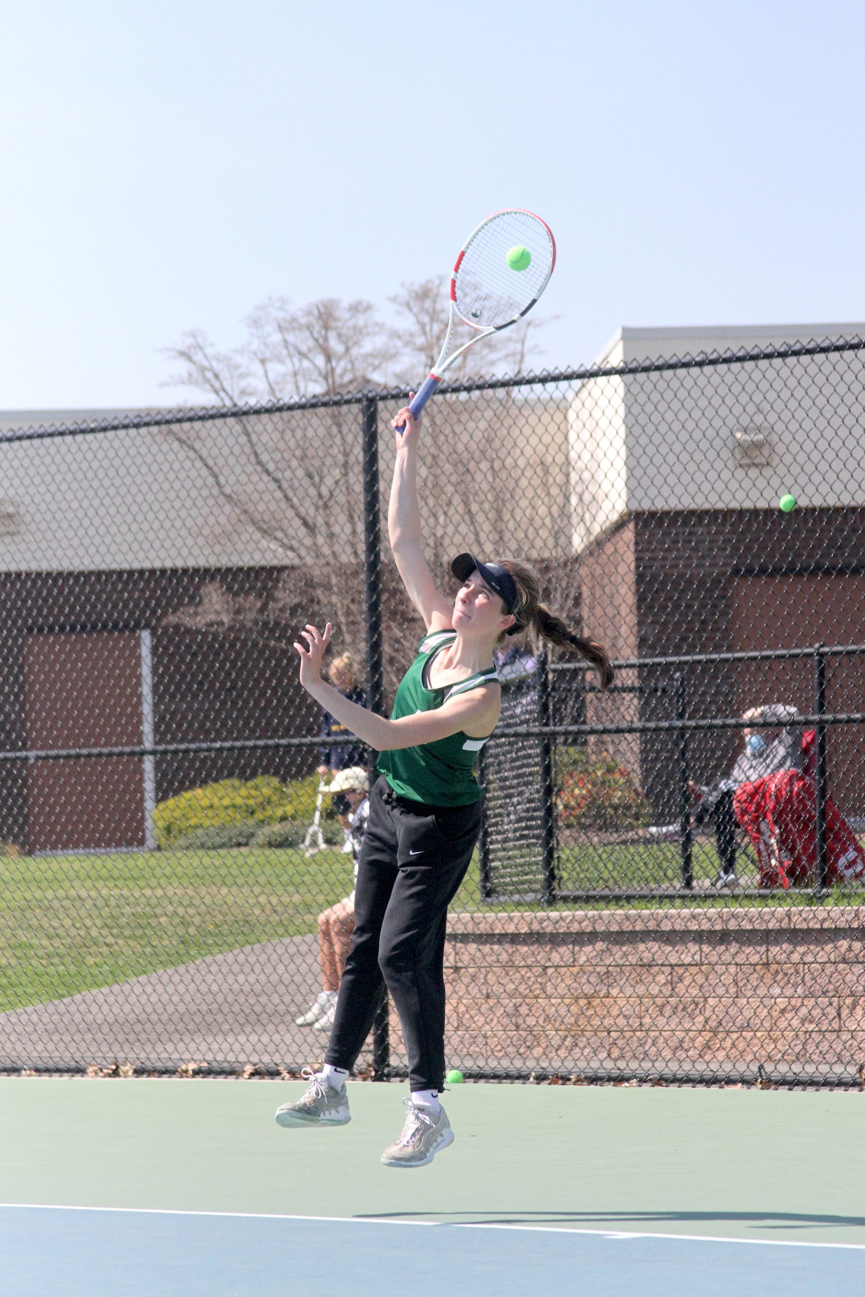 Westhampton Beach junior Rose Hayes serves the ball in the Division IV singles finals.