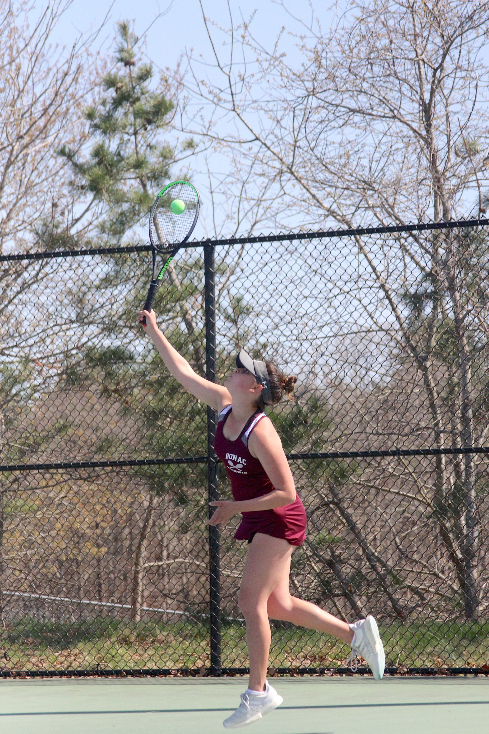 Pierson junior Sandrine Becht serves the ball for East Hampton in the Division IV doubles finals on Tuesday.