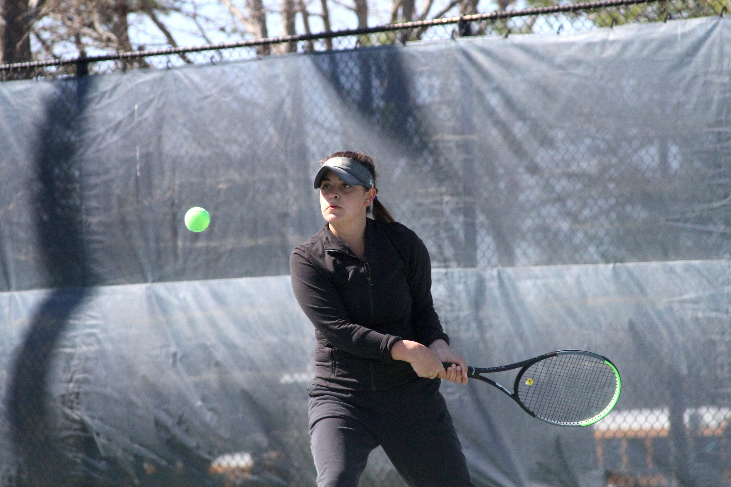 Pierson junior Sandrine Becht, a part of East Hampton's No. 4-seeded doubles team, returns a serve during the Suffolk County quarterfinals.