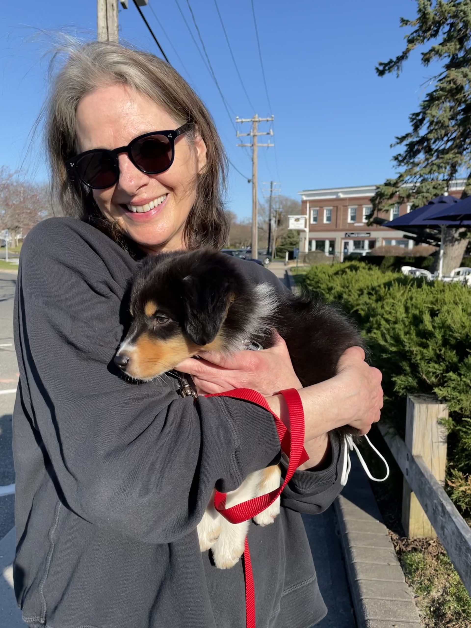 Susan Merrell snuggles her new puppy, Otto.