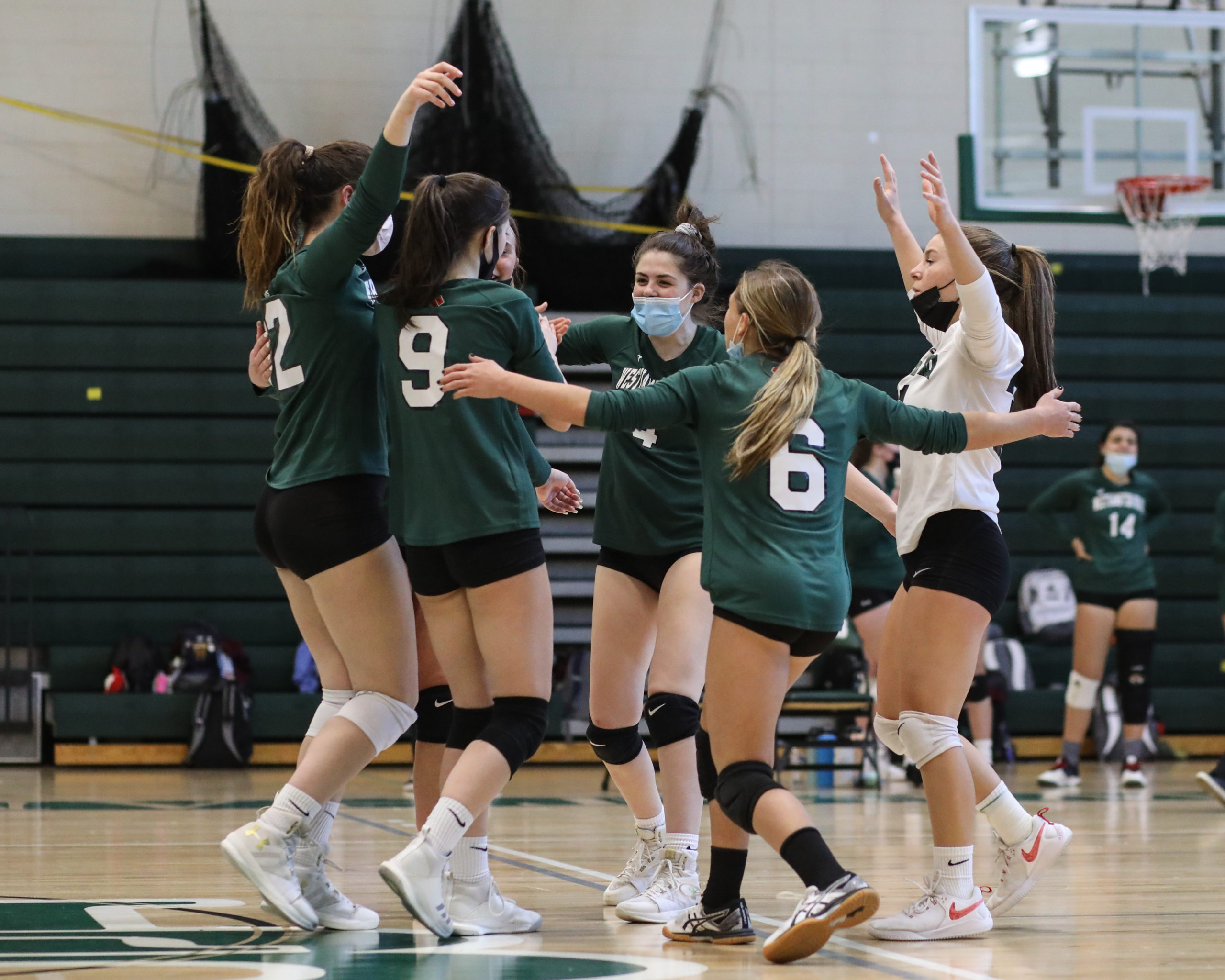 Westhampton Beach's girls volleyball team celebrates its first-set win over Kings Park.