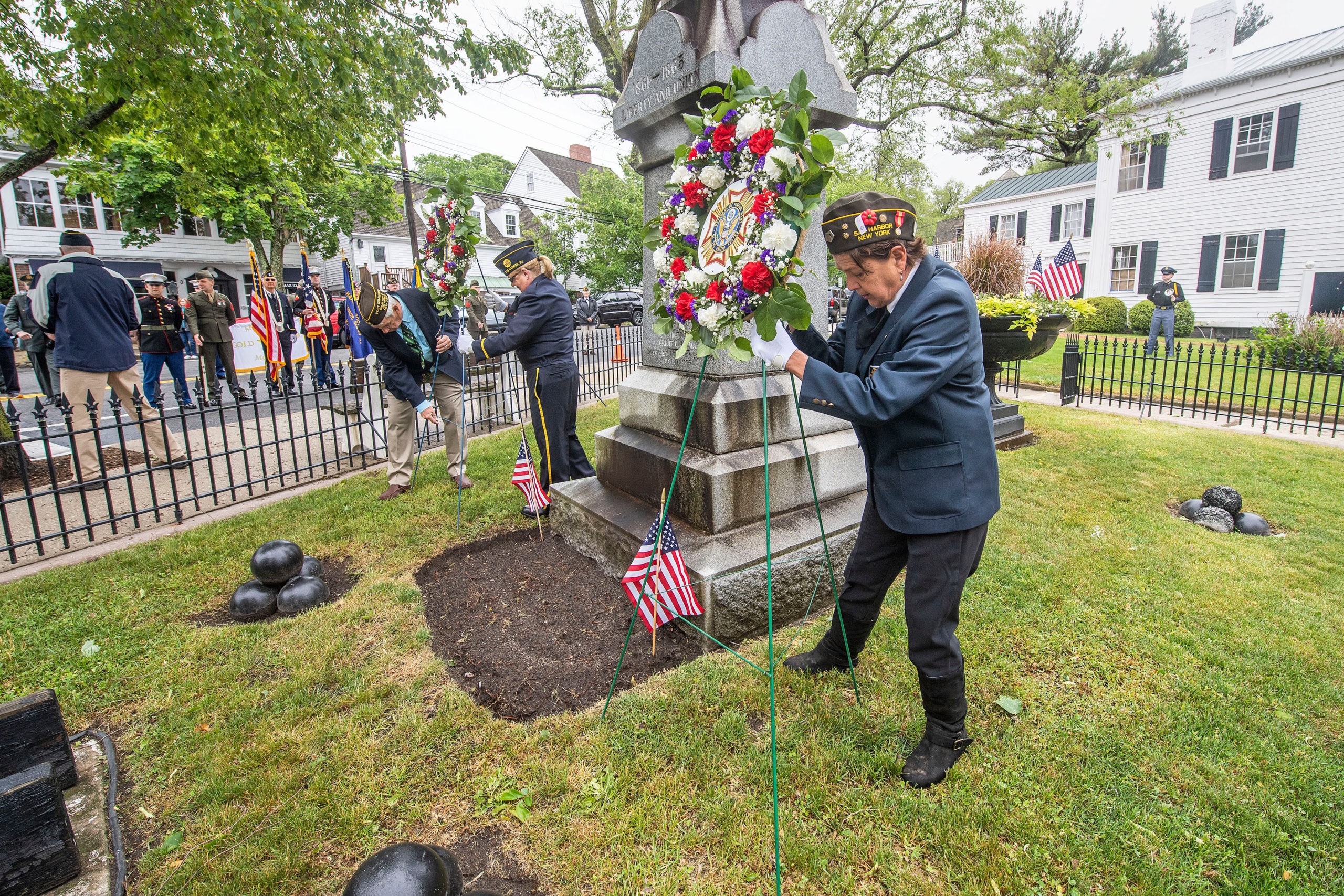 Wreathes are placed at the war memorial at the intersection of Main and Madison Streets during the 2021 Memorial Day parade and ceremonies in Sag Harbor on Monday.     MICHAEL HELLER