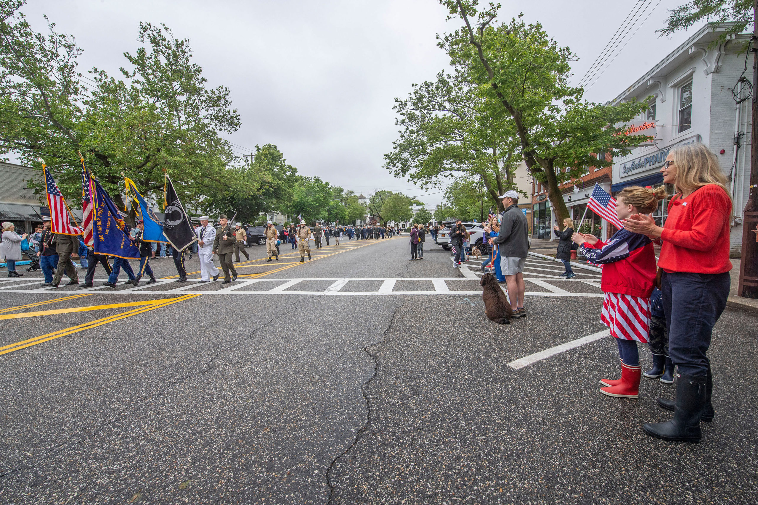 The parade makes its way down Main Street during the 2021 Memorial Day parade and ceremonies in Sag Harbor on Monday.   MICHAEL HELLER