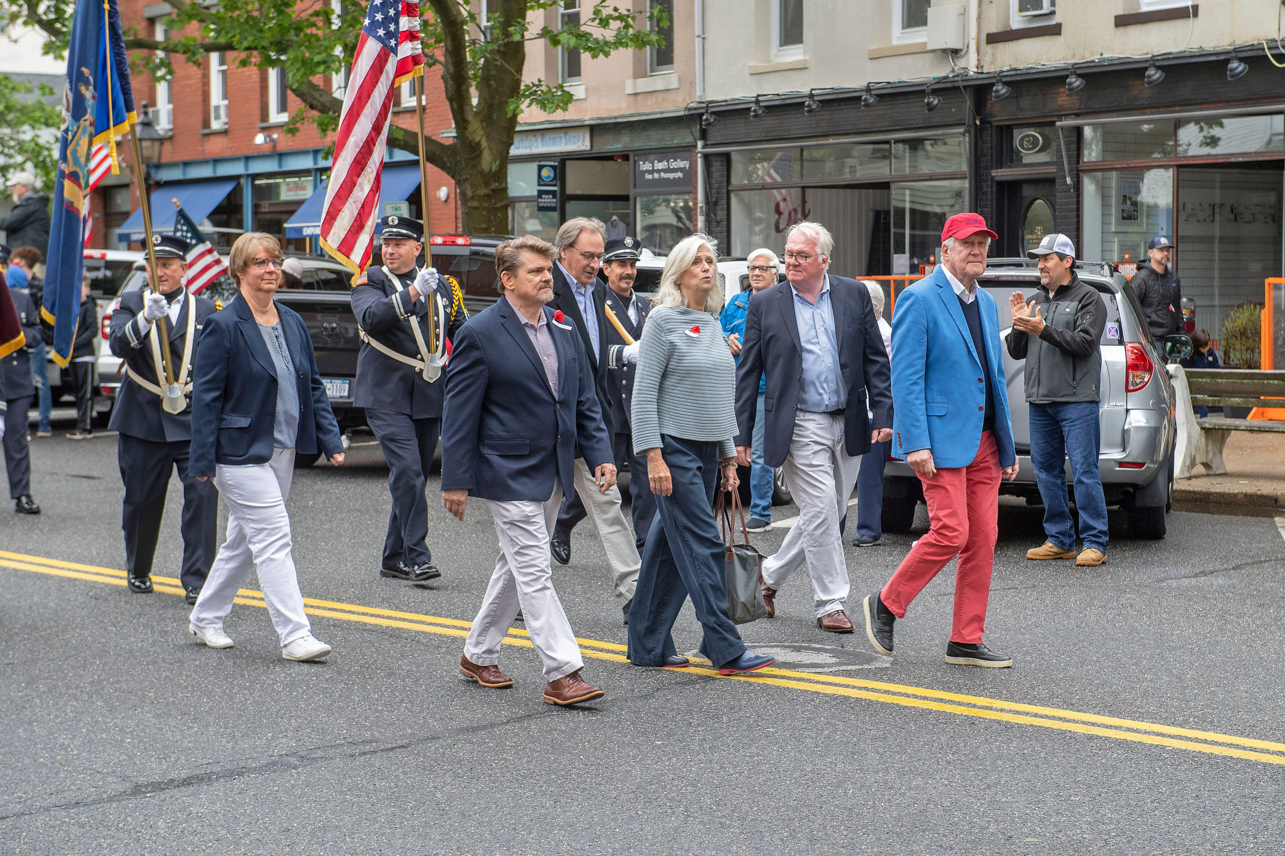 Local officials march together as the parade makes its way down Main Street during the 2021 Memorial Day parade and ceremonies in Sag Harbor on Monday.    MICHAEL HELLER
