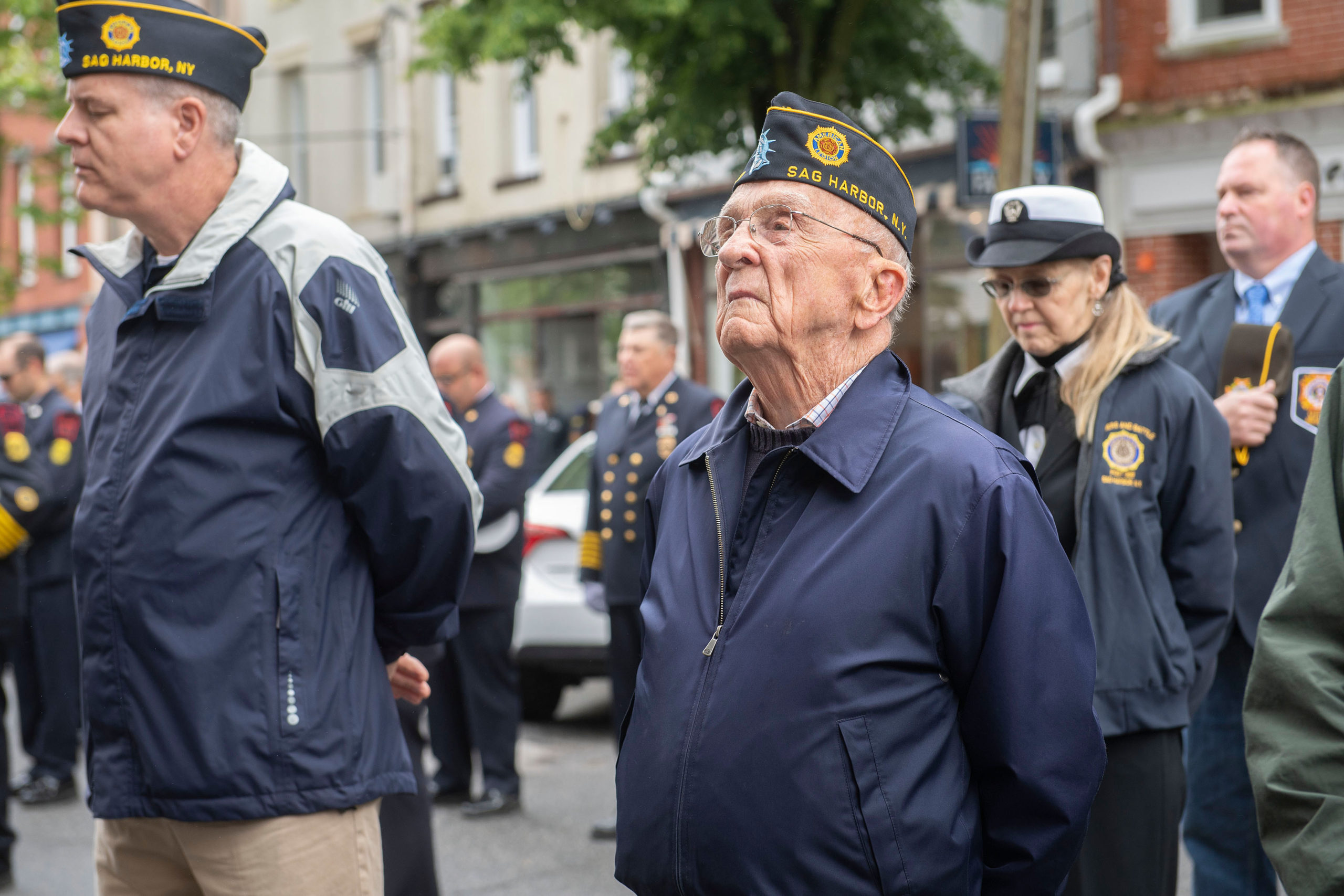 A veteran stands in formation and listens during a ceremony in front of the Main Street firehouse during the 2021 Memorial Day parade and ceremonies in Sag Harbor on Monday.    MICHAEL HELLER