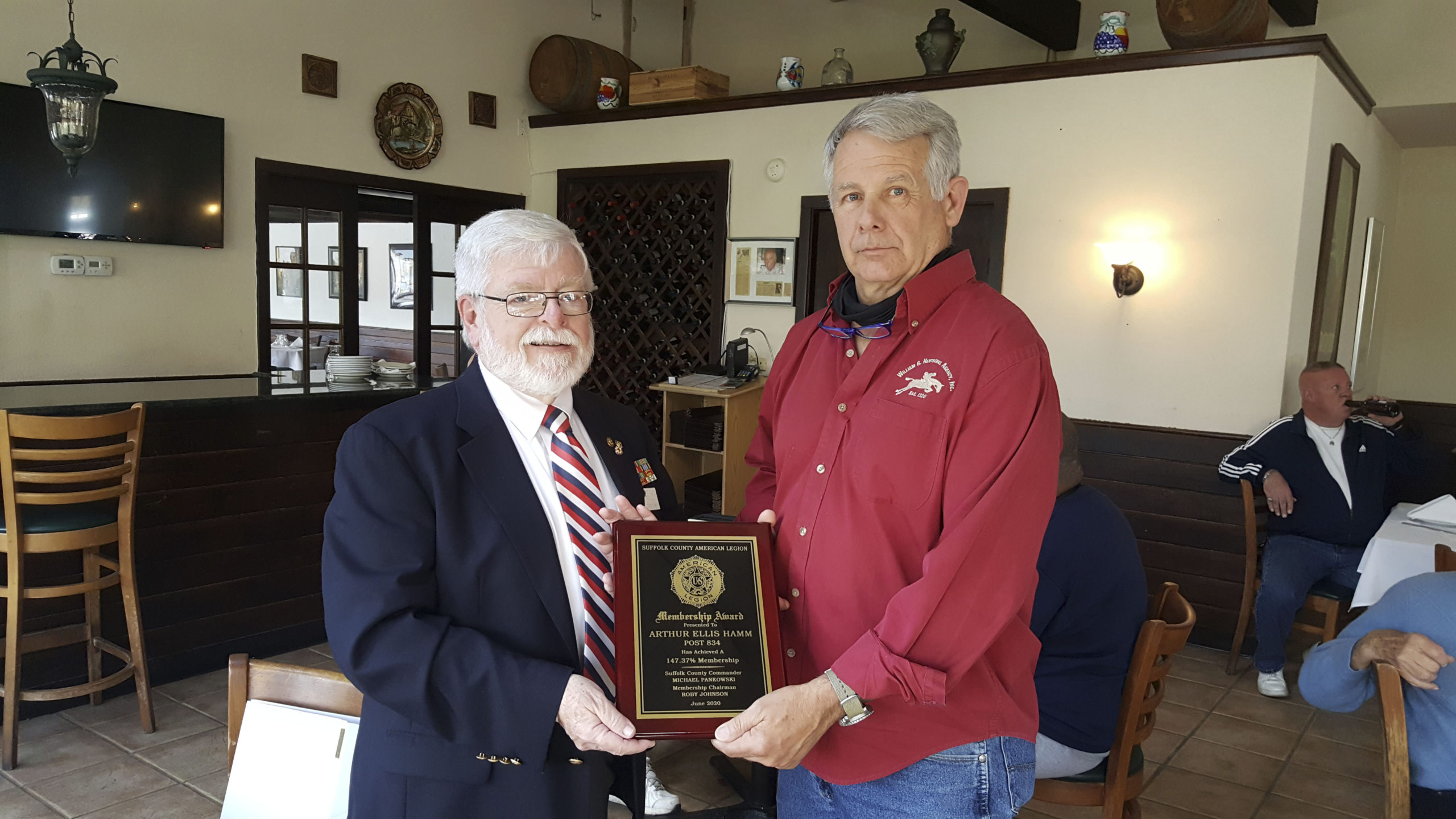 Membership Chair Fred Bauer of the American Legion Arthur Ellis Hamm Post 834 in Westhampton recently accepted a plaque of acknowledgement of a 20% increase in membership  from Rob Robesch, current judge advocate for the 10th district and past Nassau County Commander.