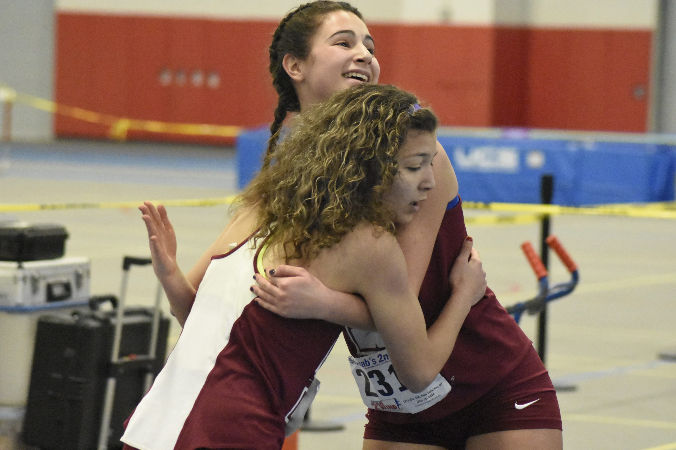 Amanda Mannino and Gabriela Arnold embrace each other after finishing a relay race in February 2020.