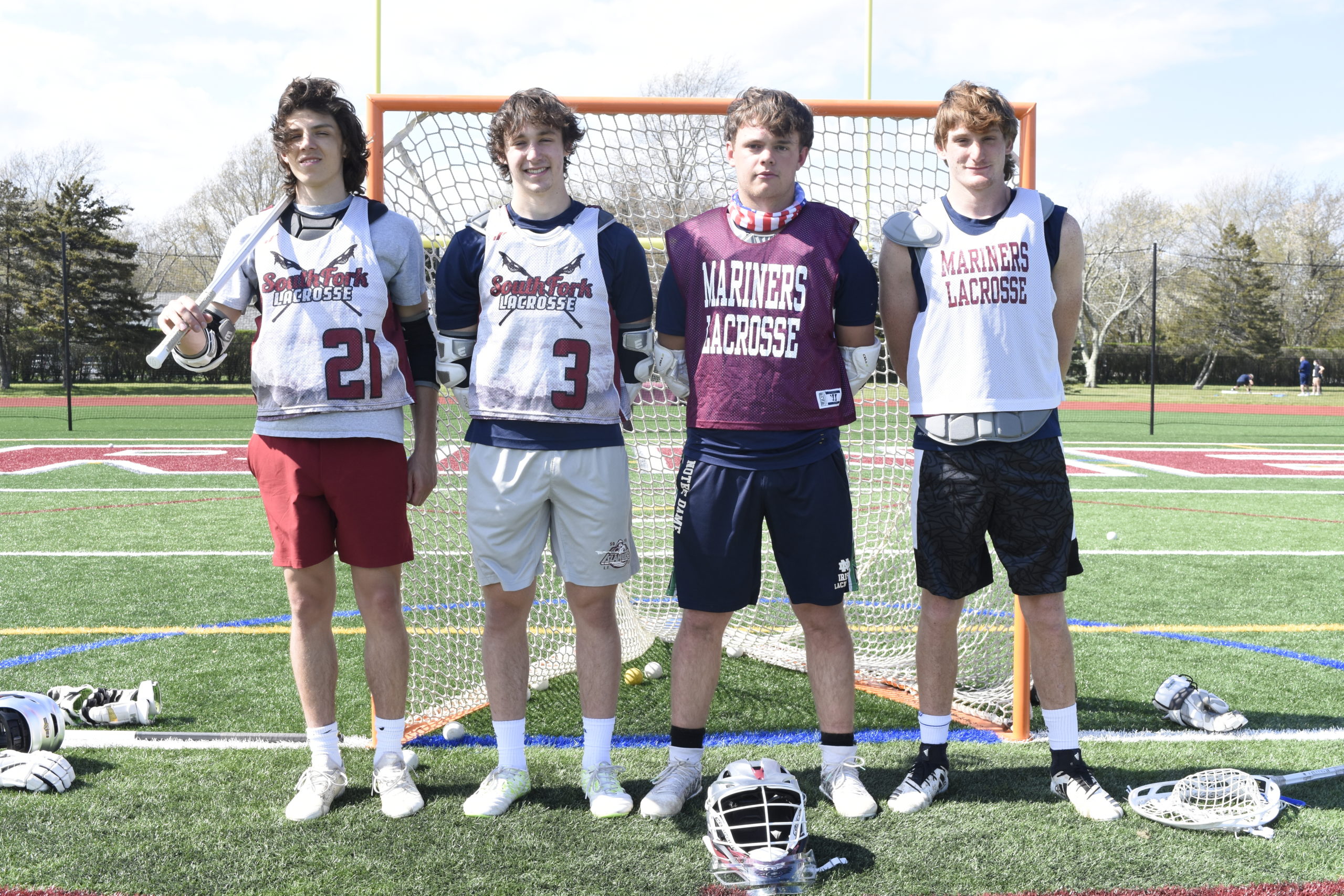 Captains for the South Fork boys lacrosse team this season include, from left, Southampton's Luke Marro and Zac Mobius, East Hampton's Aidan Cooper and Pierson's Hudson Brindle.  DREW BUDD