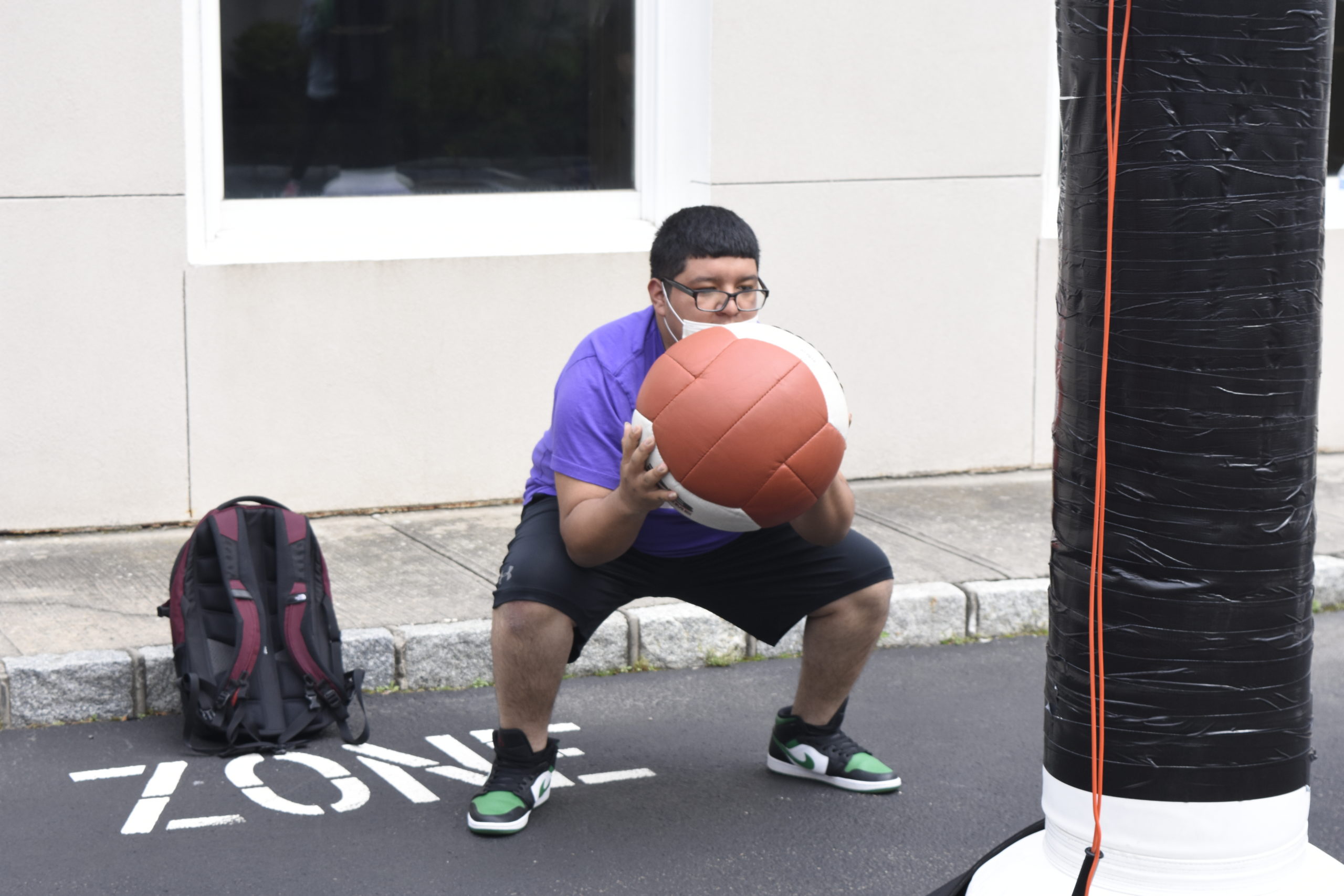 Alexander Franco works out with a medicine ball at Hill Street Boxing on Friday.