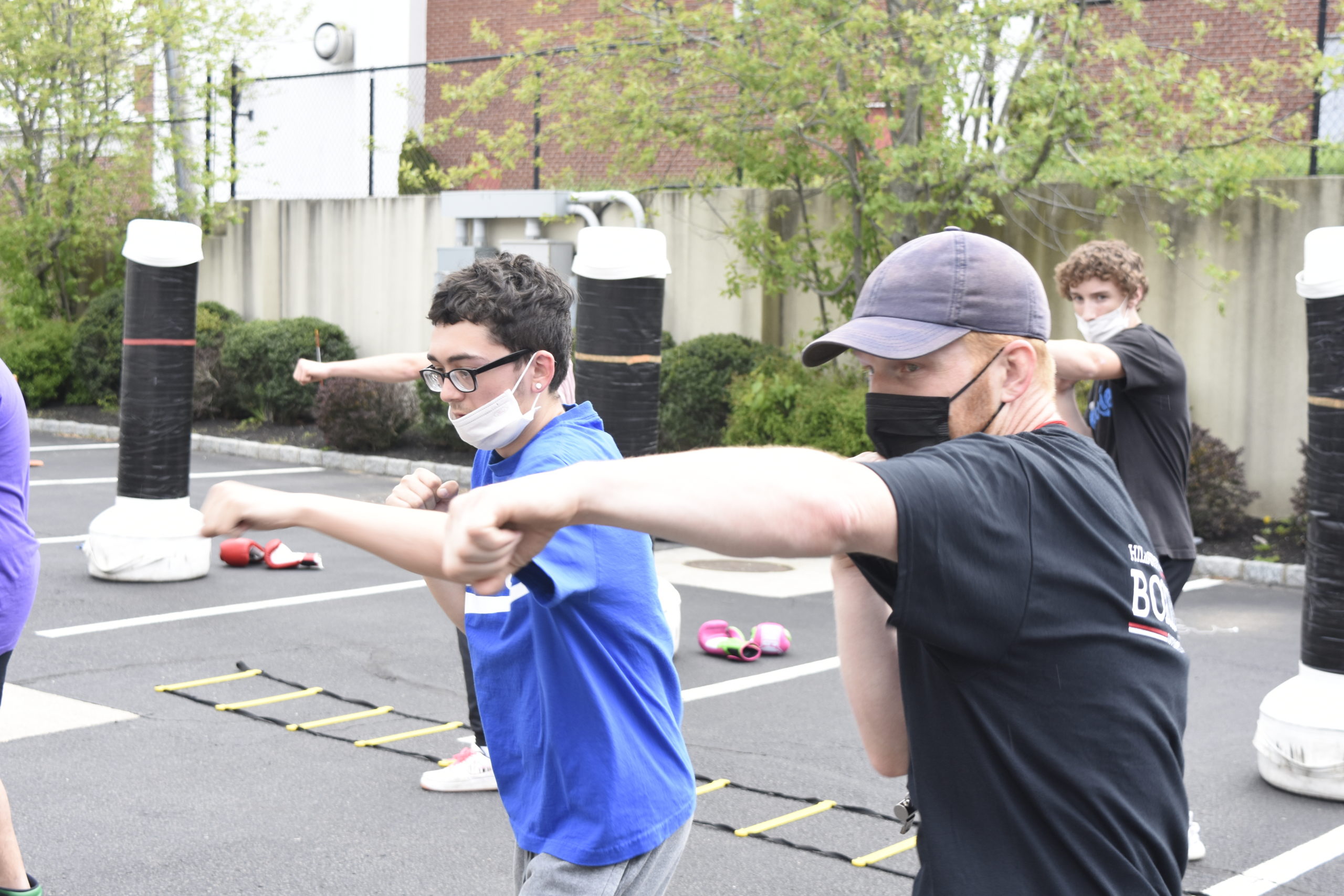 Avery Crocker, right, shows Tim McCarthy  how to correctly throw a jab.