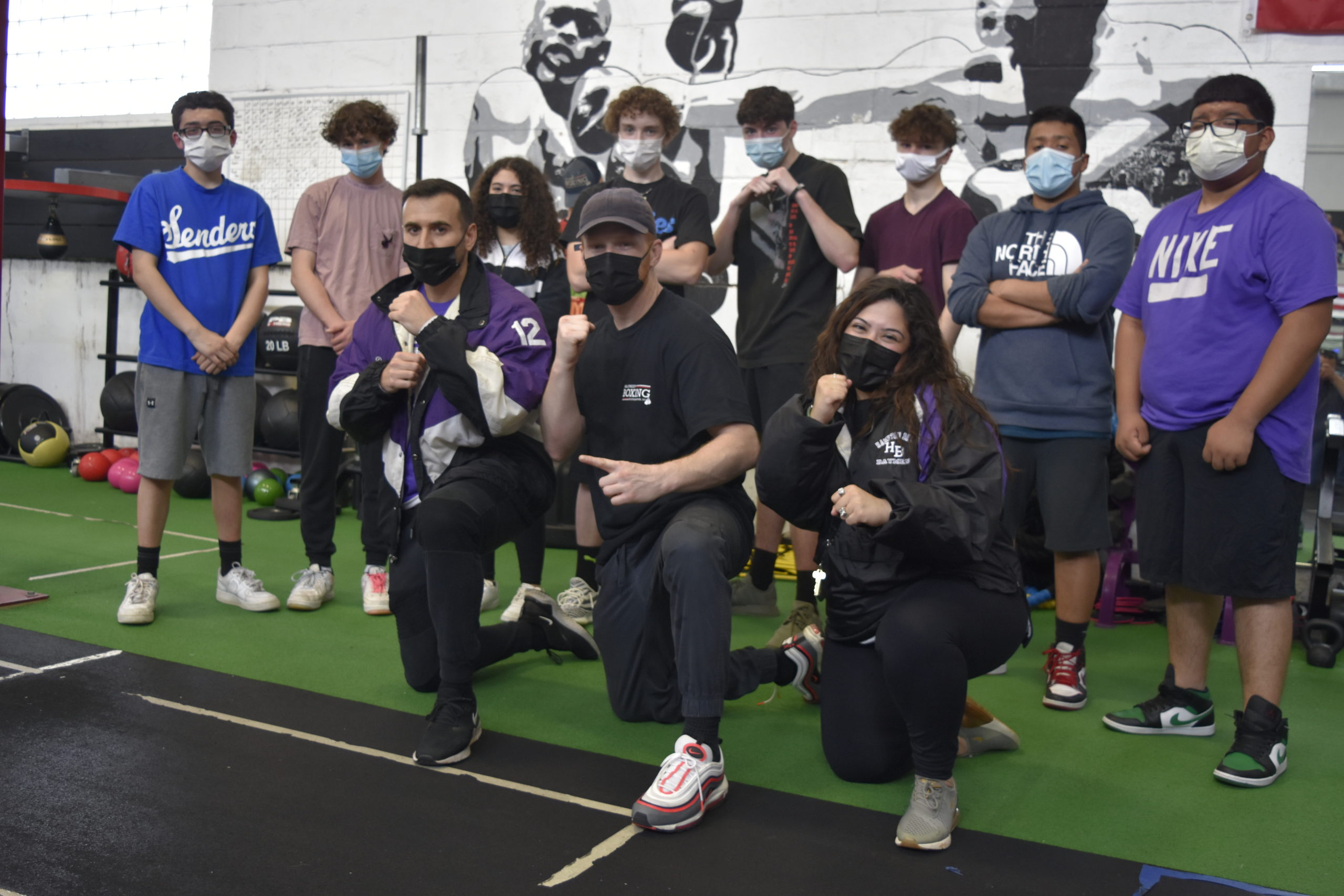 Hampton Bays students at Hill Street Boxing with social work intern Christopher DeRosa, Avery Crocker, and Hampton Bays High School social worker Yoeli Vargas.