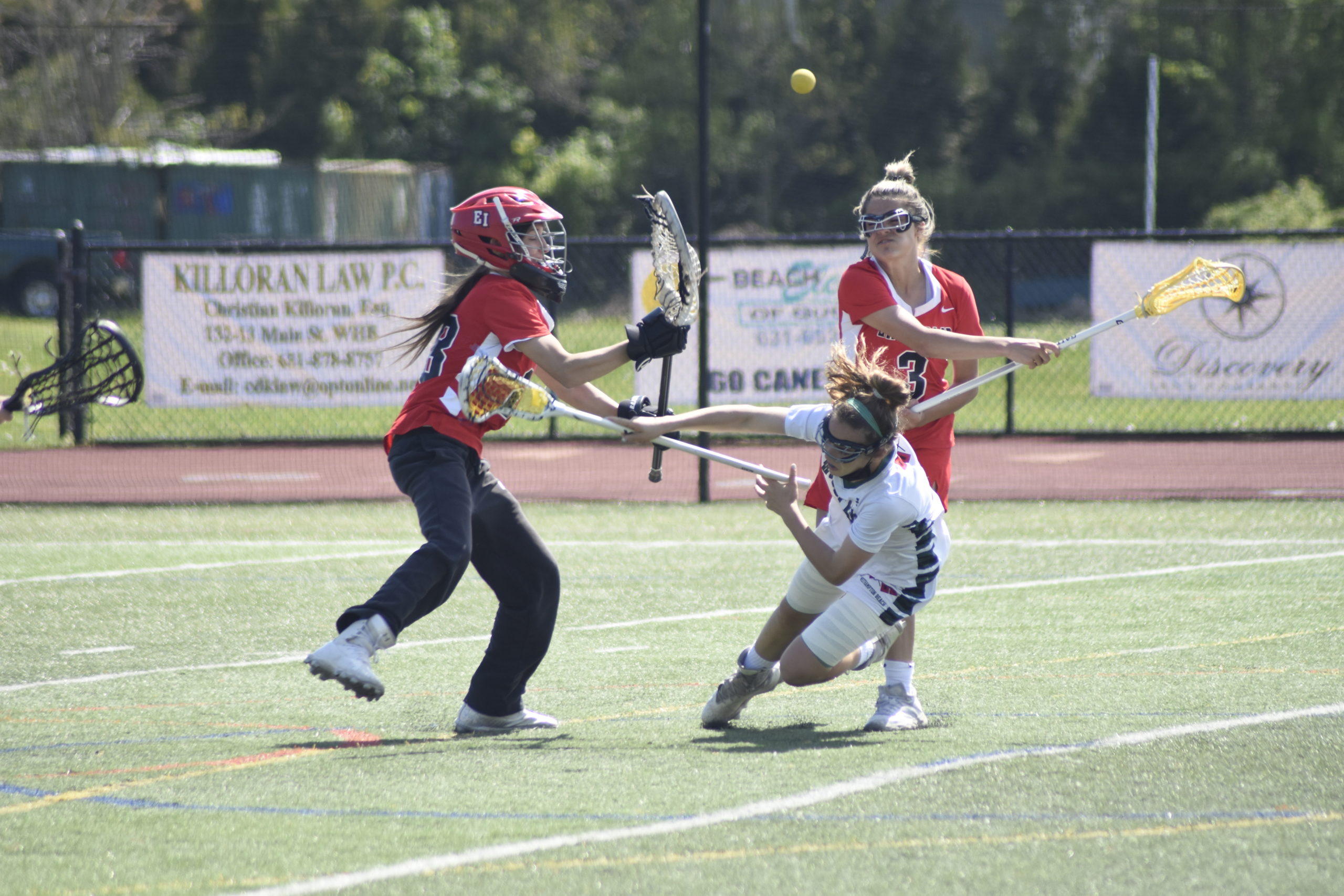 Westhampton Beach seventh-grader Ava Derby is sent to the turf by an East Islip defender, drawing a free position shot.