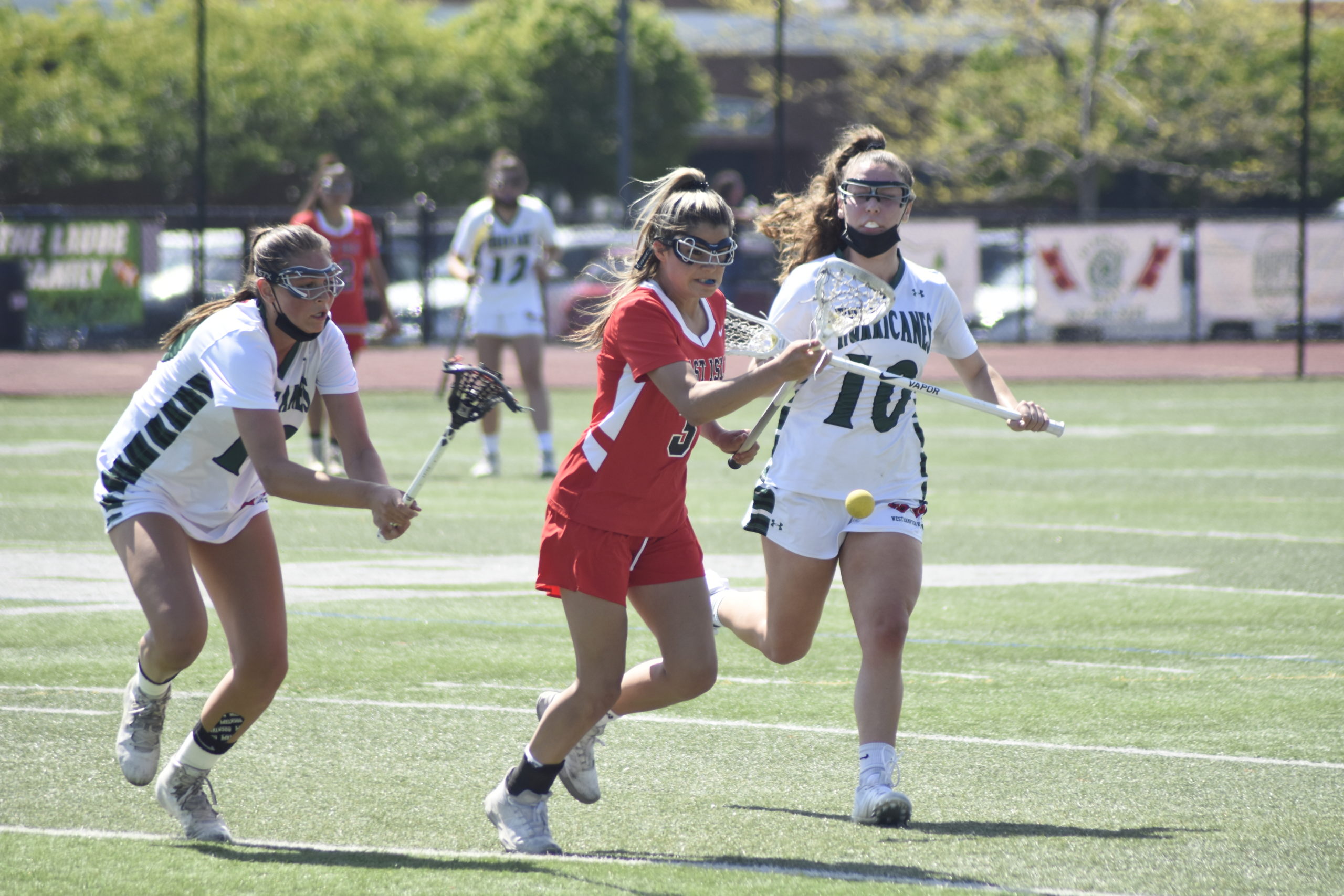 Westhampton Beach seniors Olivia Rongo, left, and Maureen Duffy pressure an East Islip player.