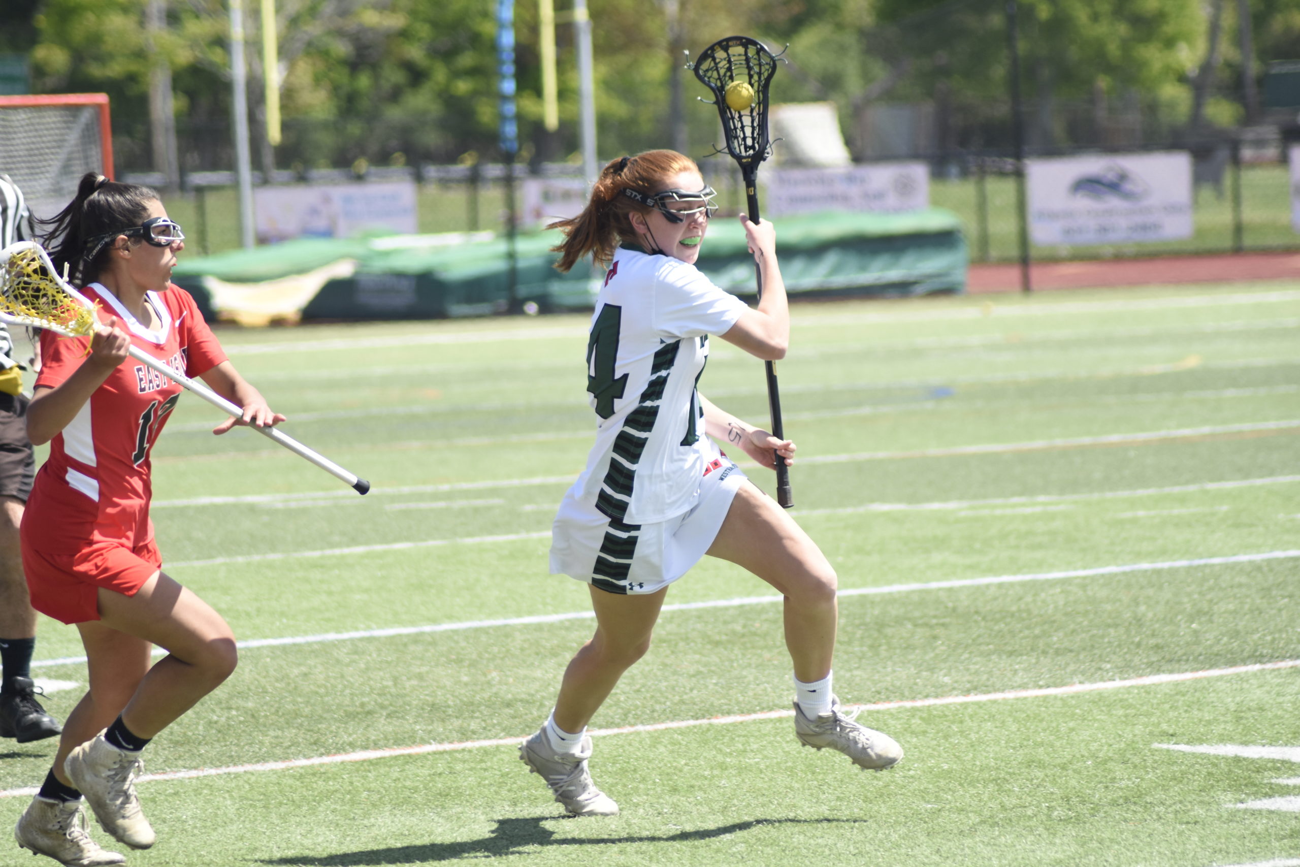 Westhampton Beach senior Jackie Amato avoids pressure from an East Islip player and races the ball downfield.