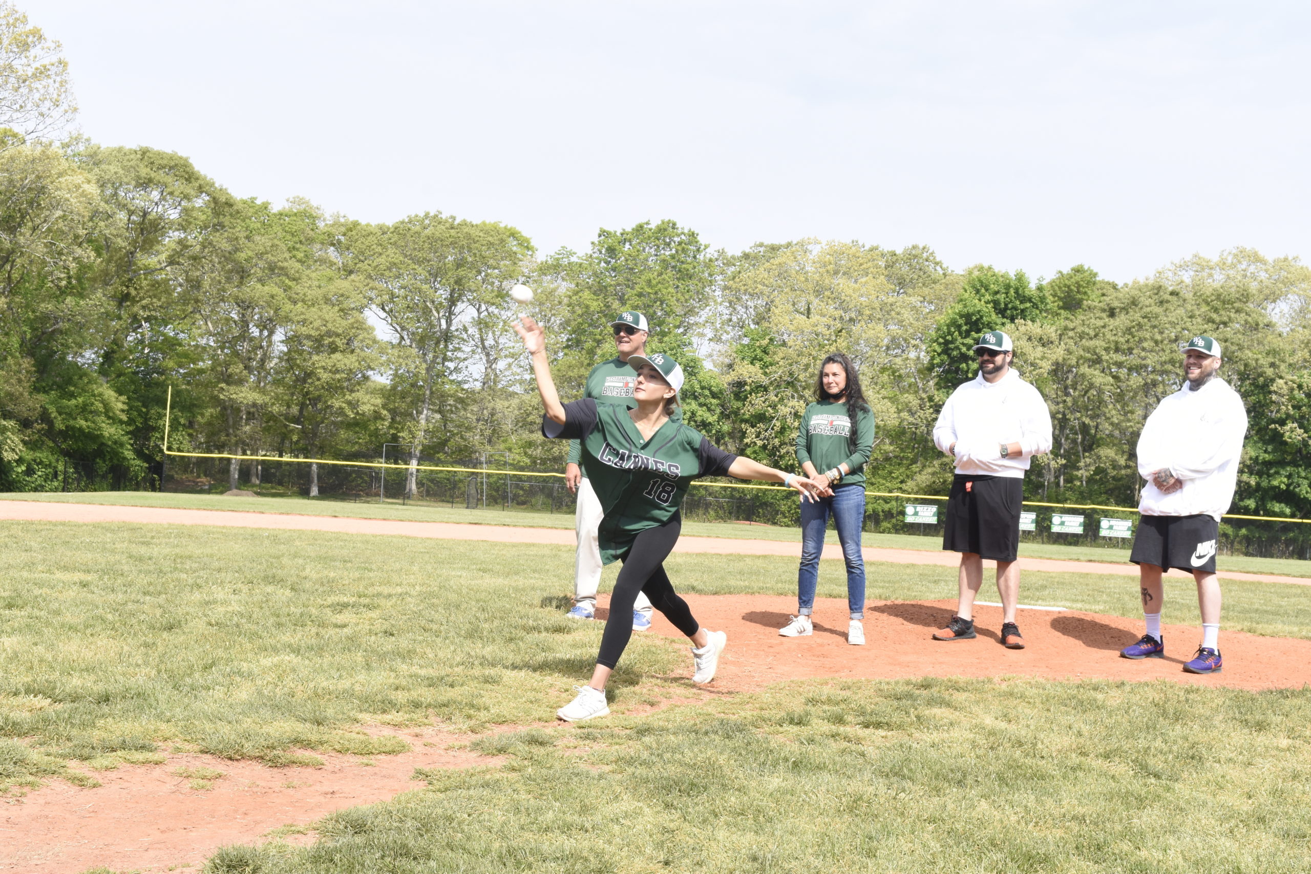 Ava Mongelluzzo throws a strike for the memorial first pitch.