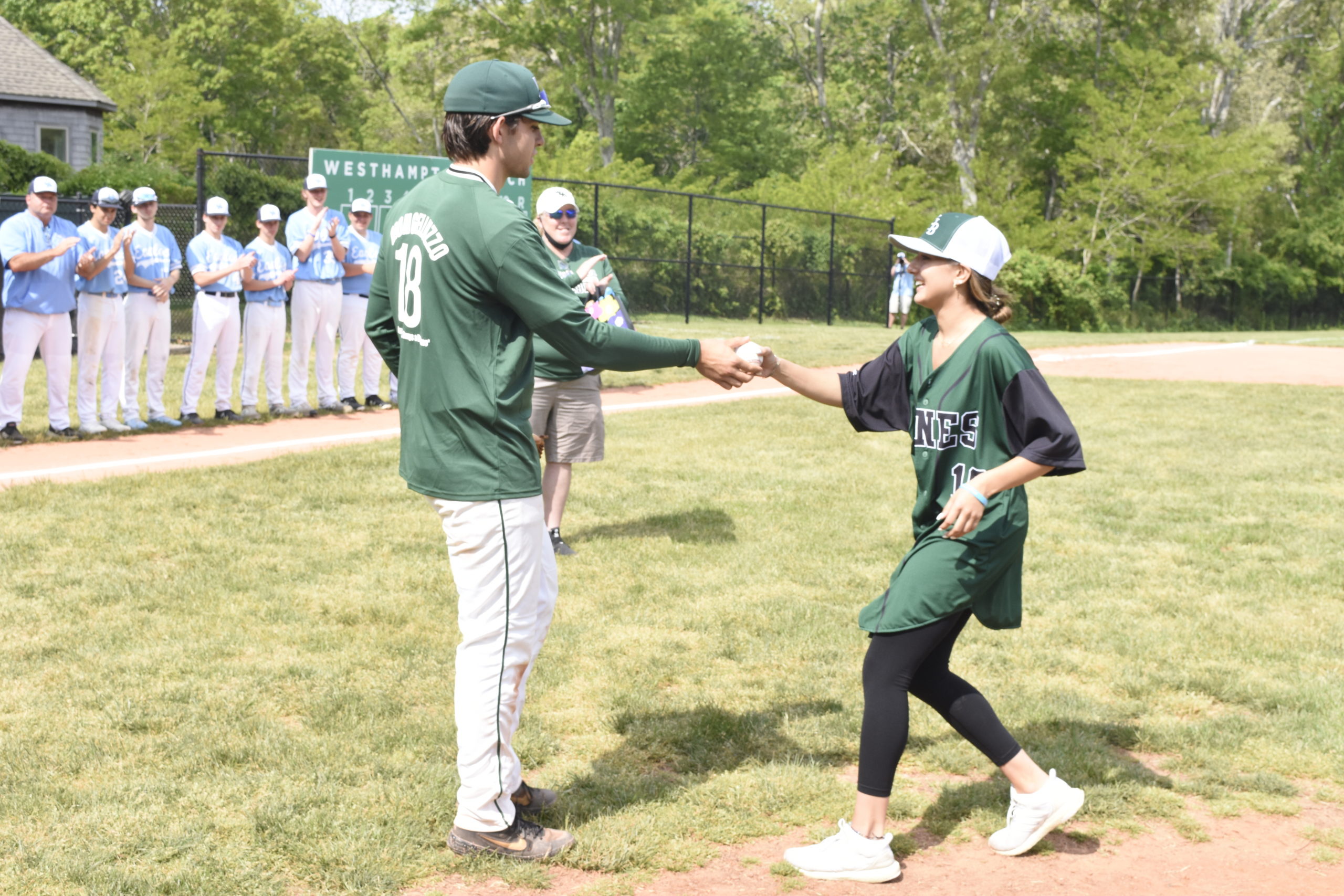 Westhampton Beach senior Jack Halloran gives the ball back to Ava Mongelluzzo.