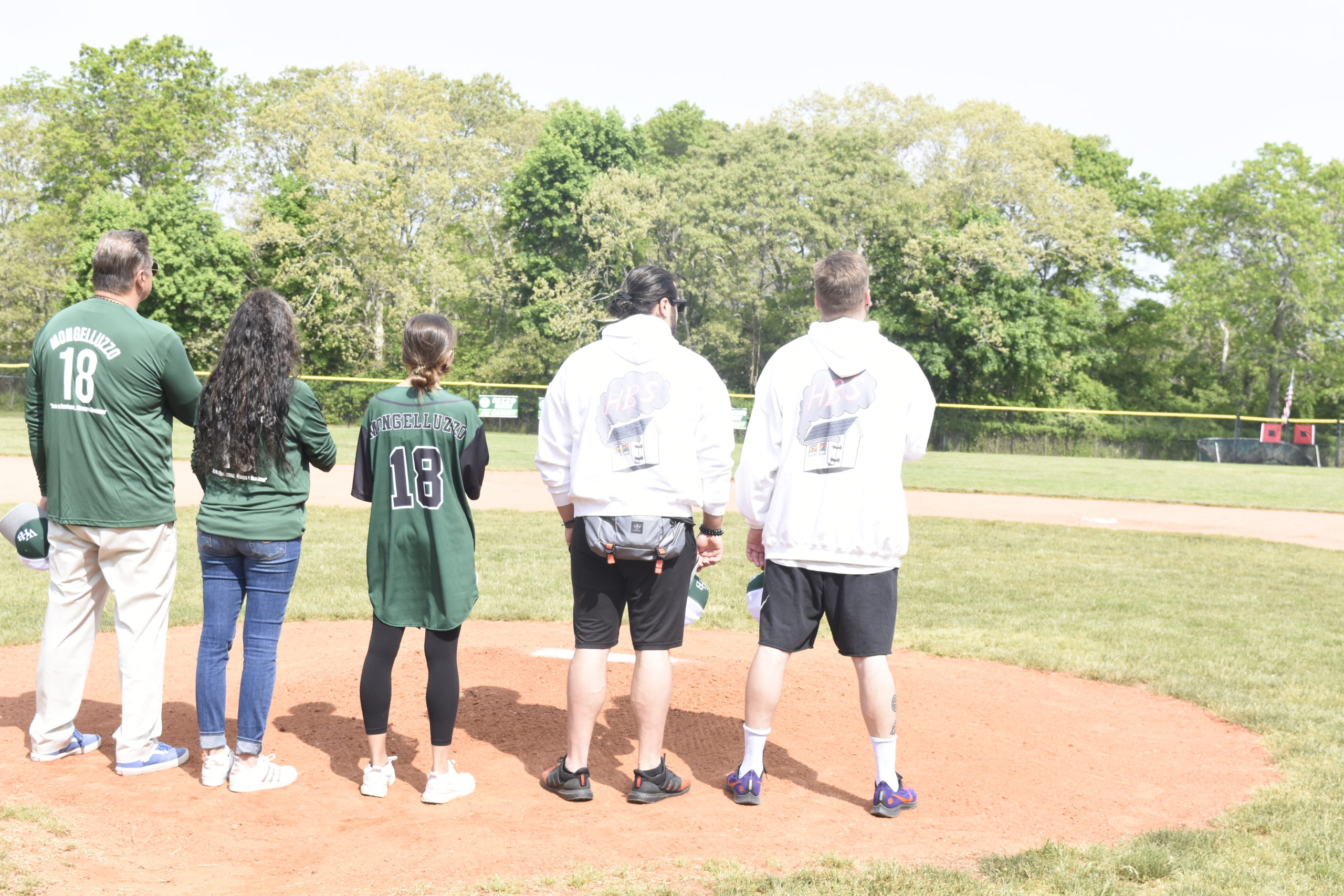 The Mongelluzzo Family on the mound during the National Anthem.