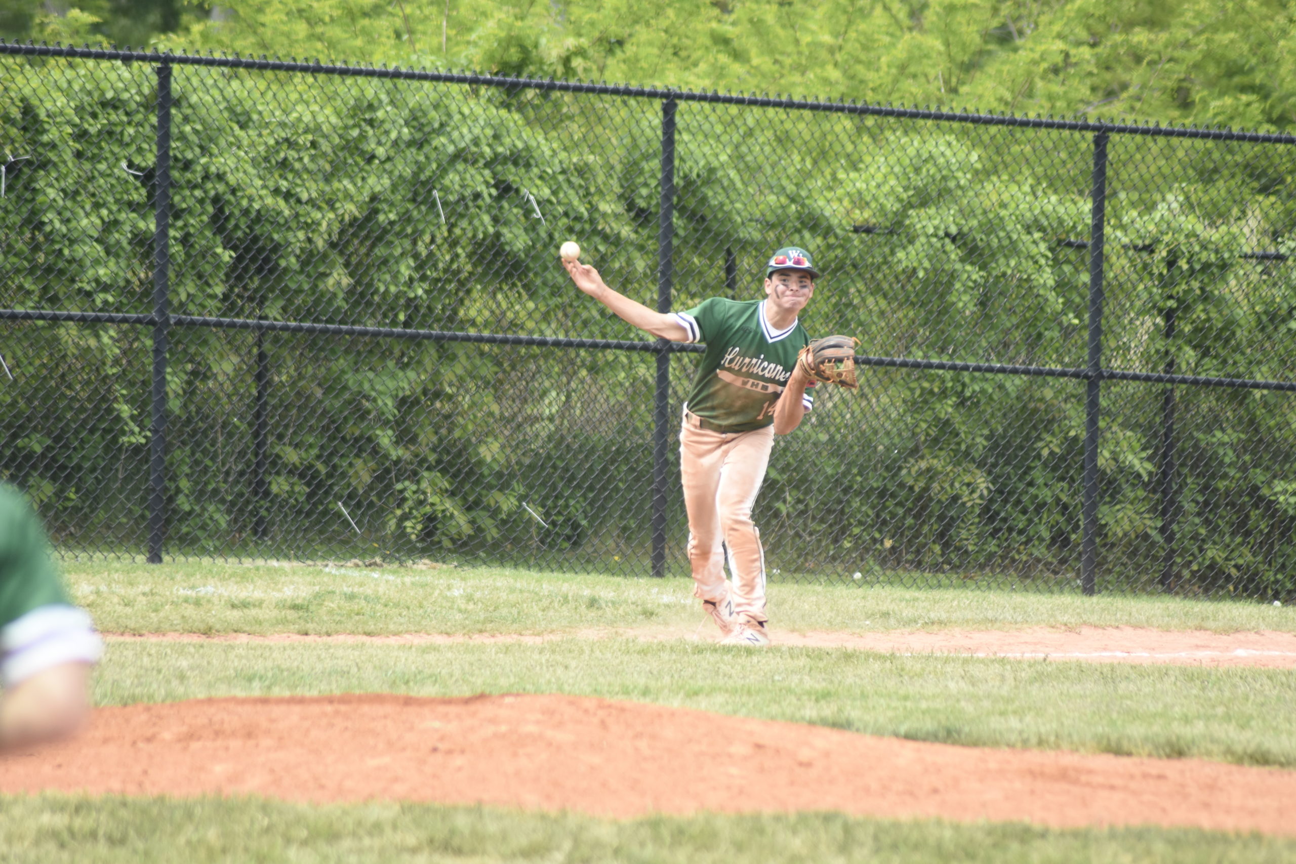 Westhampton Beach third baseman Ryan Sheehan throws to first.