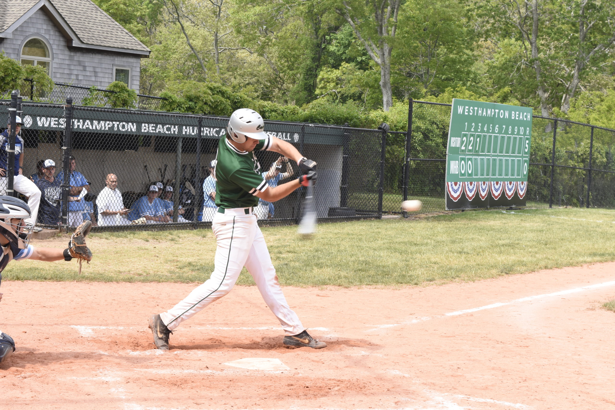 Westhampton Beach senior Jack Halloran lines a base hit into left field.